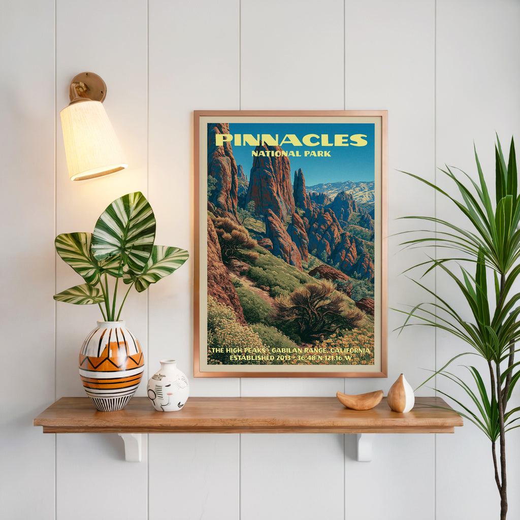 High Peaks Pinnacles print framed on white panelling above an oak shelf with a patterned vase and brass sconce