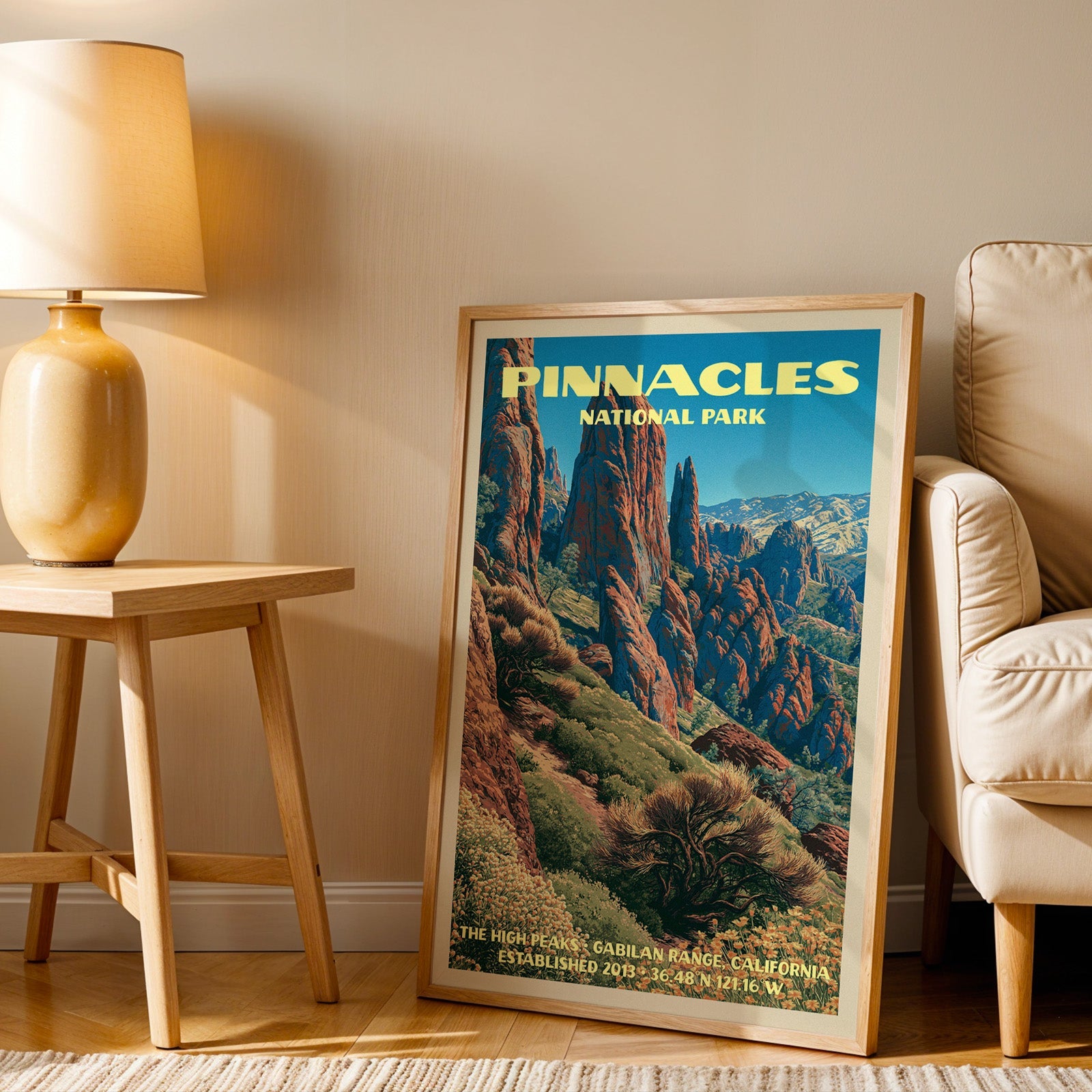 High Peaks Pinnacles wall art in oak, leaning by an armchair and a side table with an ochre ceramic lamp