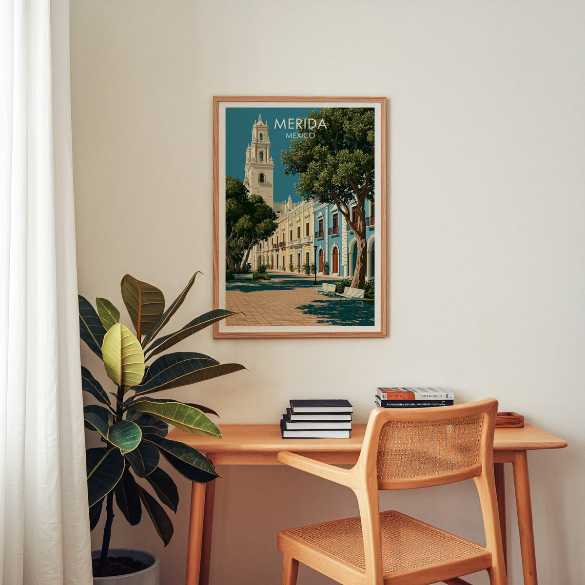 Shaded arcade walkway poster in an oak frame above a wooden home-office desk with a cane chair.