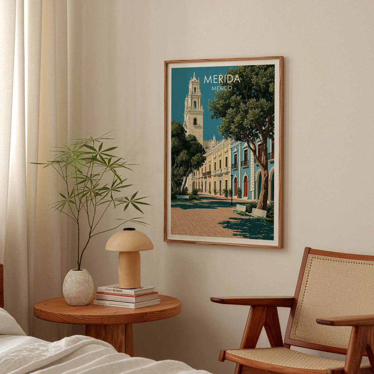 Plaza Grande print in an oak frame above a bedside table with a mushroom lamp and bamboo stems.