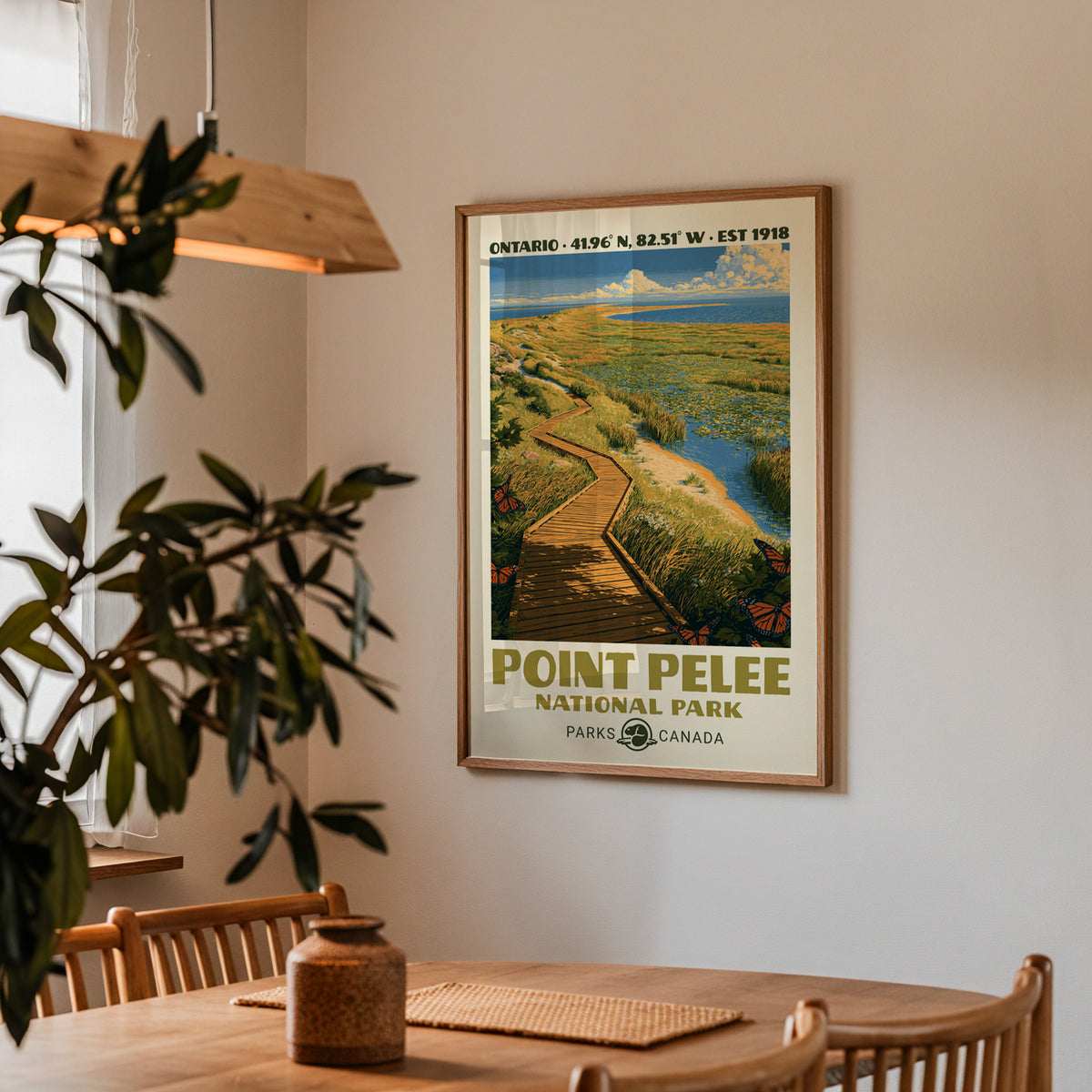 Point Pelee marsh boardwalk poster in an oak frame in a dining corner above an oak table