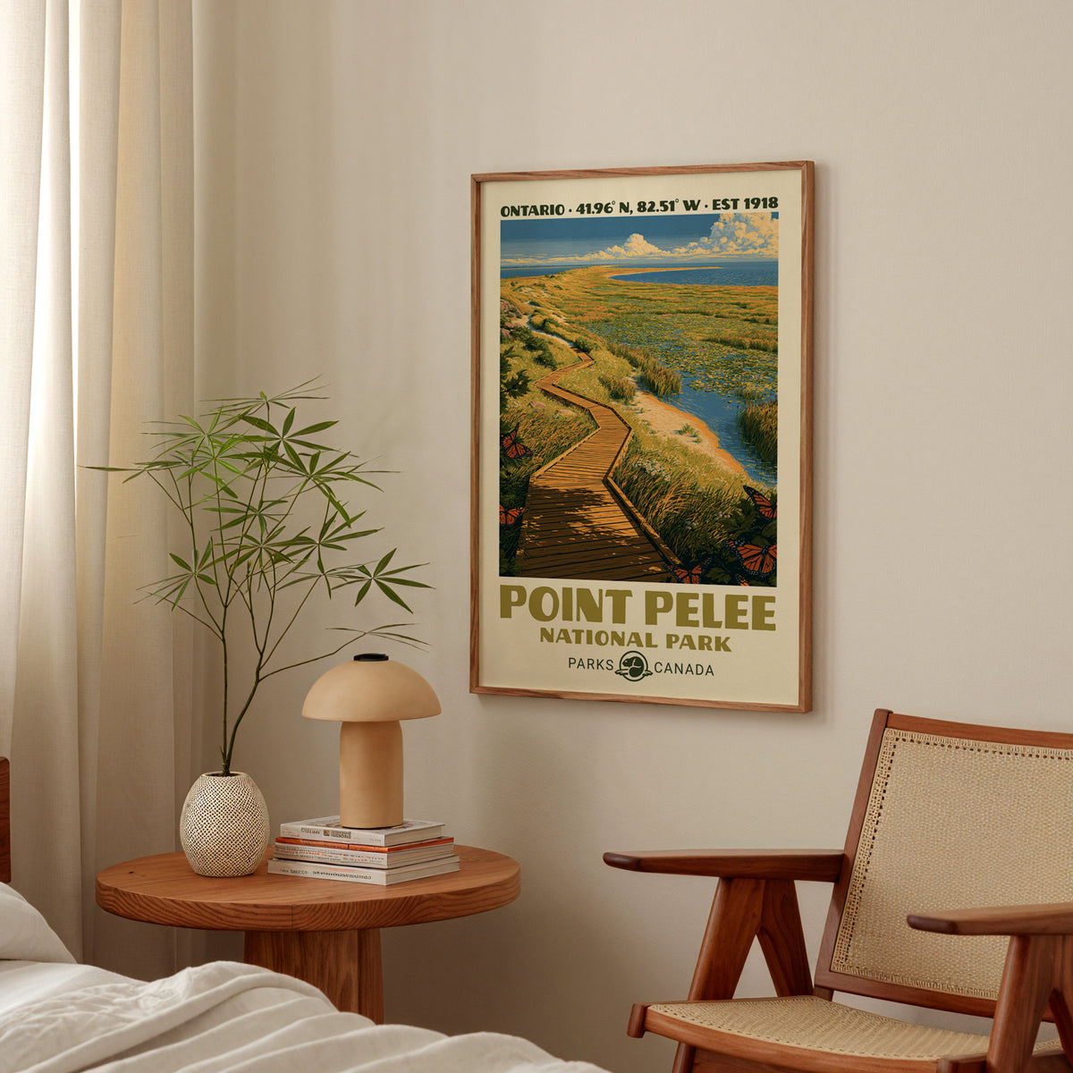 Point Pelee marsh boardwalk poster in an oak frame above a bedside table with a mushroom lamp