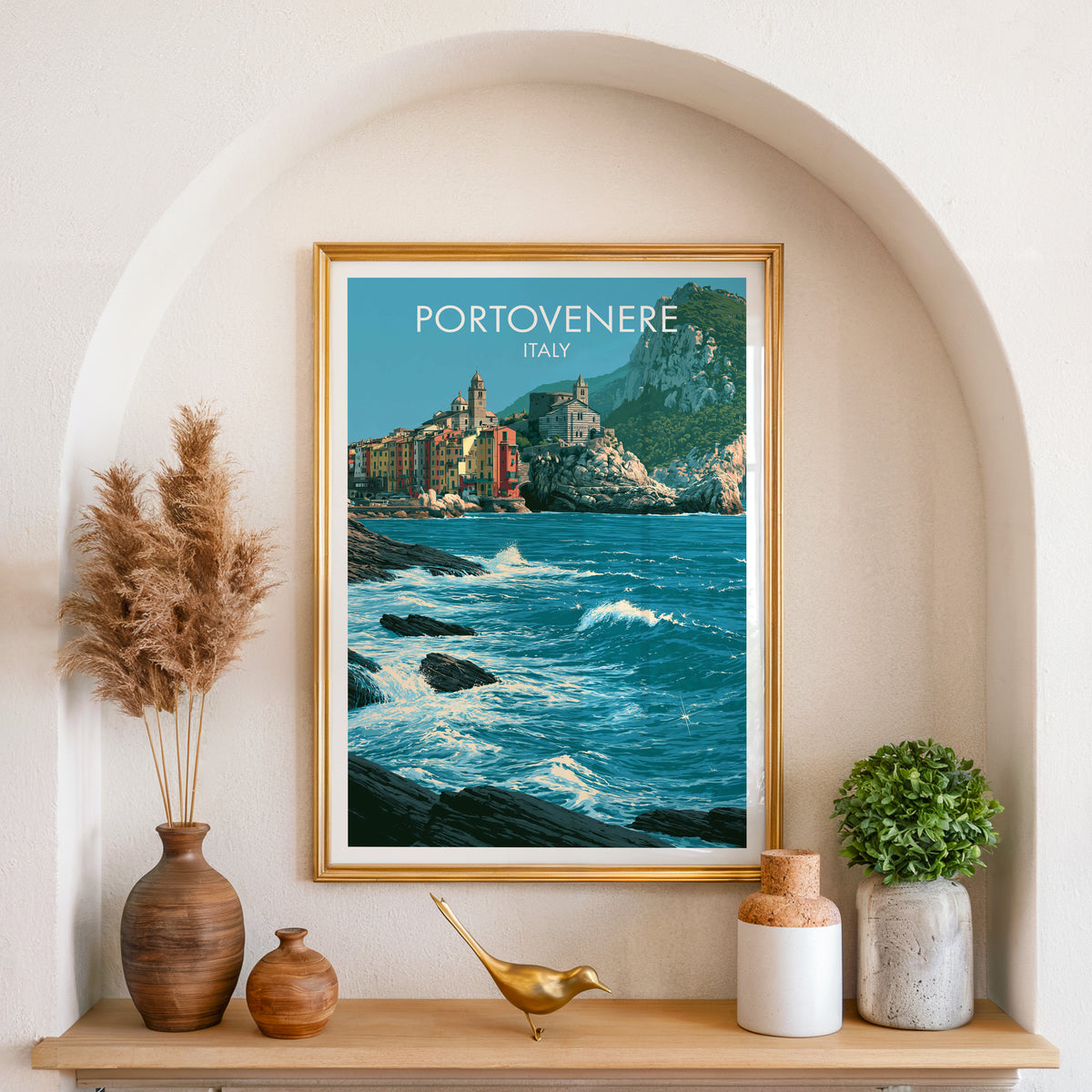 Portovenere surf poster, gold frame in an arched wall niche above pampas grass in a clay vase