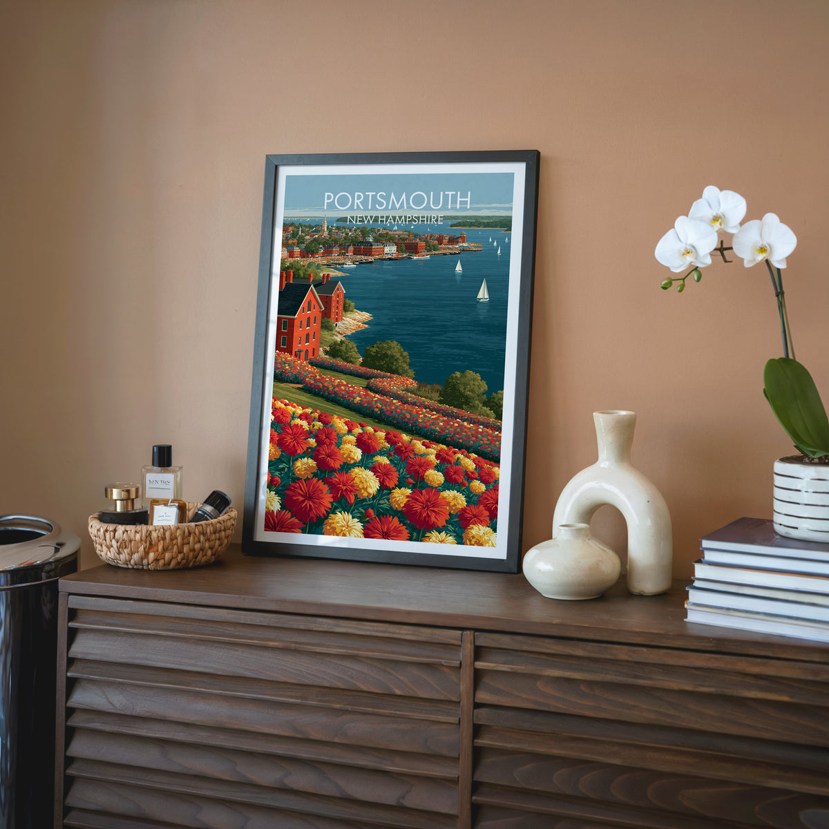 Portsmouth New Hampshire wall art in a black frame on a walnut sideboard with terracotta walls and a cream vase.
