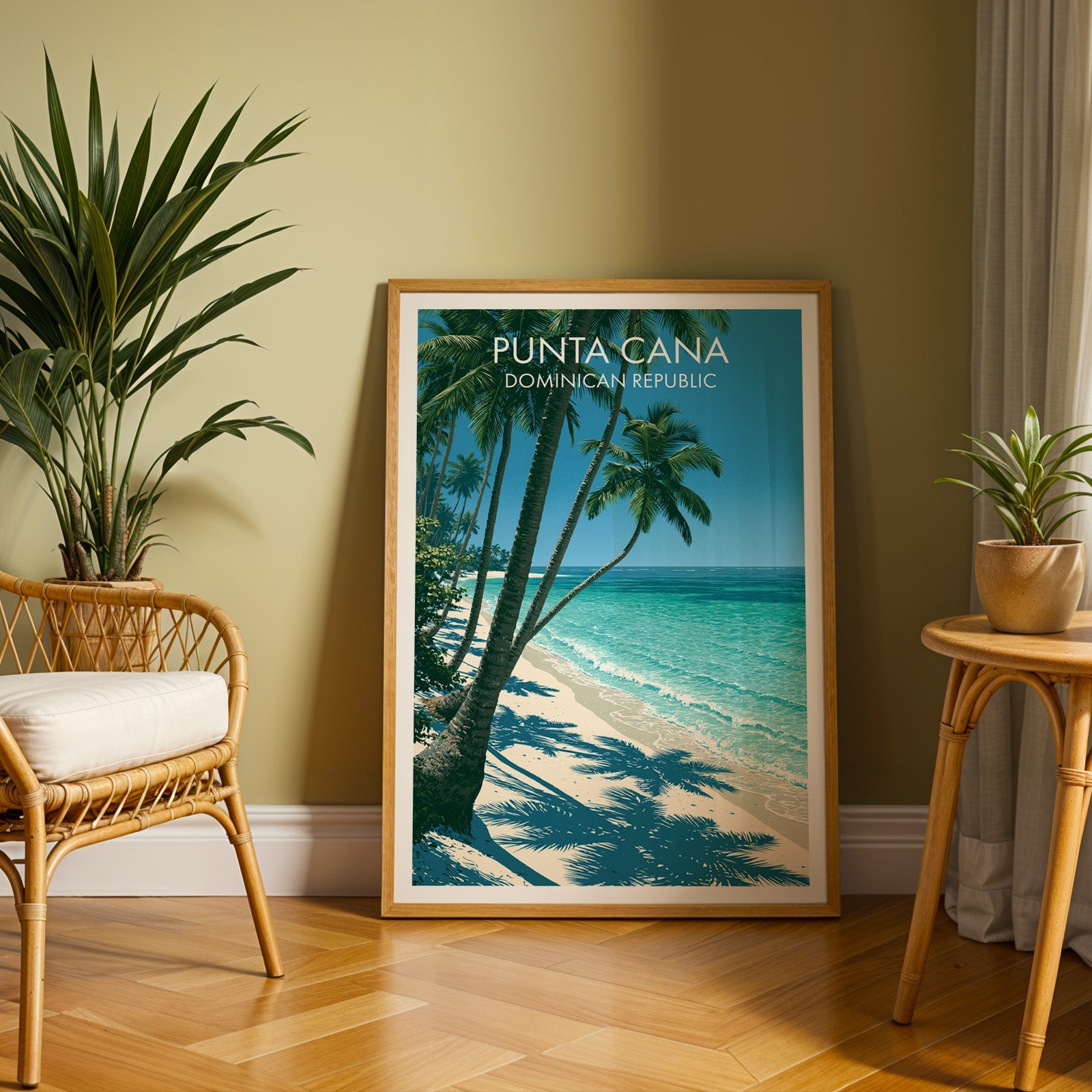 Coconut palms and shoreline art in an oak frame on herringbone parquet with a rattan chair and cane table
