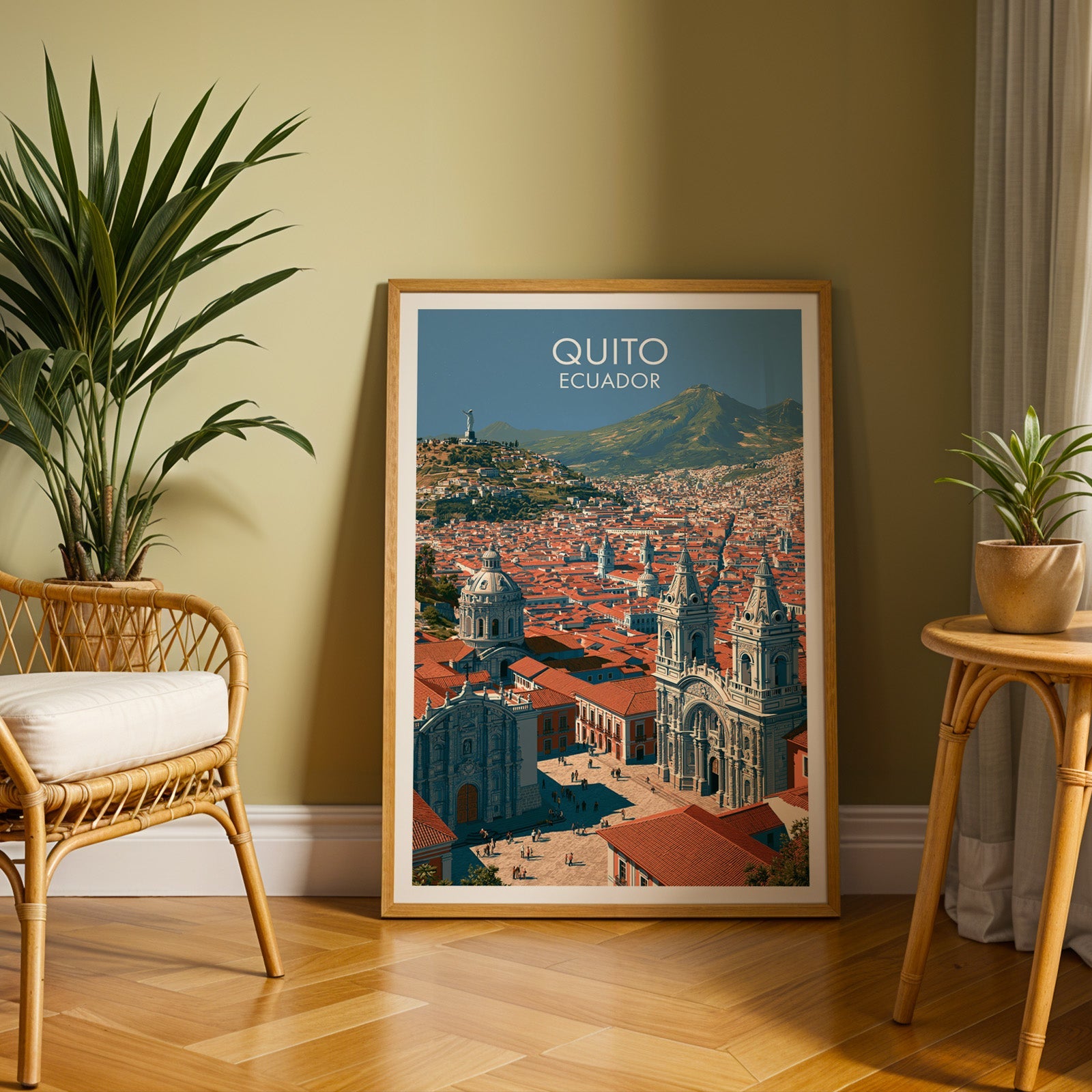 Andean city print in an oak frame on a herringbone floor against an olive wall with a rattan chair and tall palm