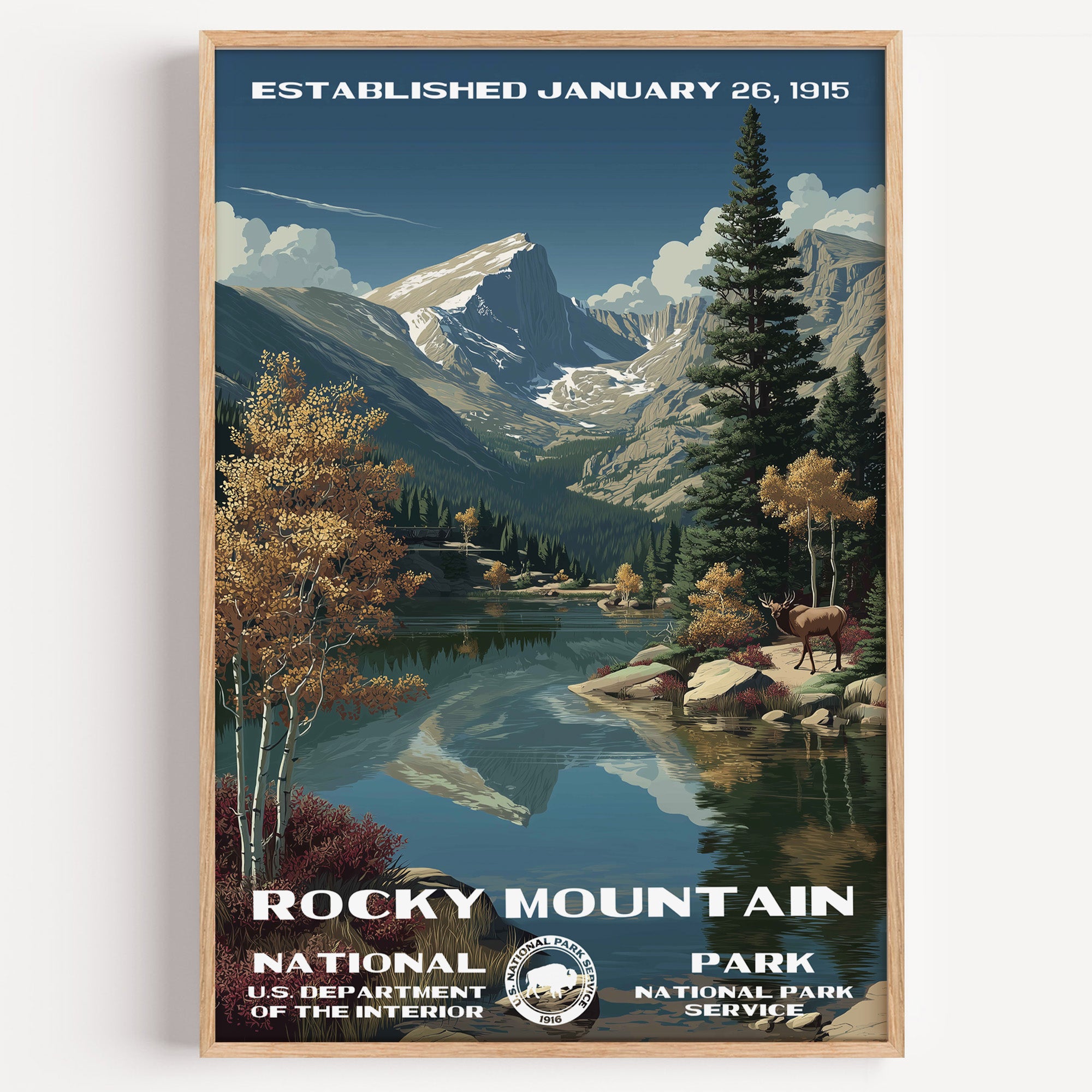 Rocky Mountain National Park vintage travel poster in a wood frame, a still alpine lake mirroring the peaks with an elk