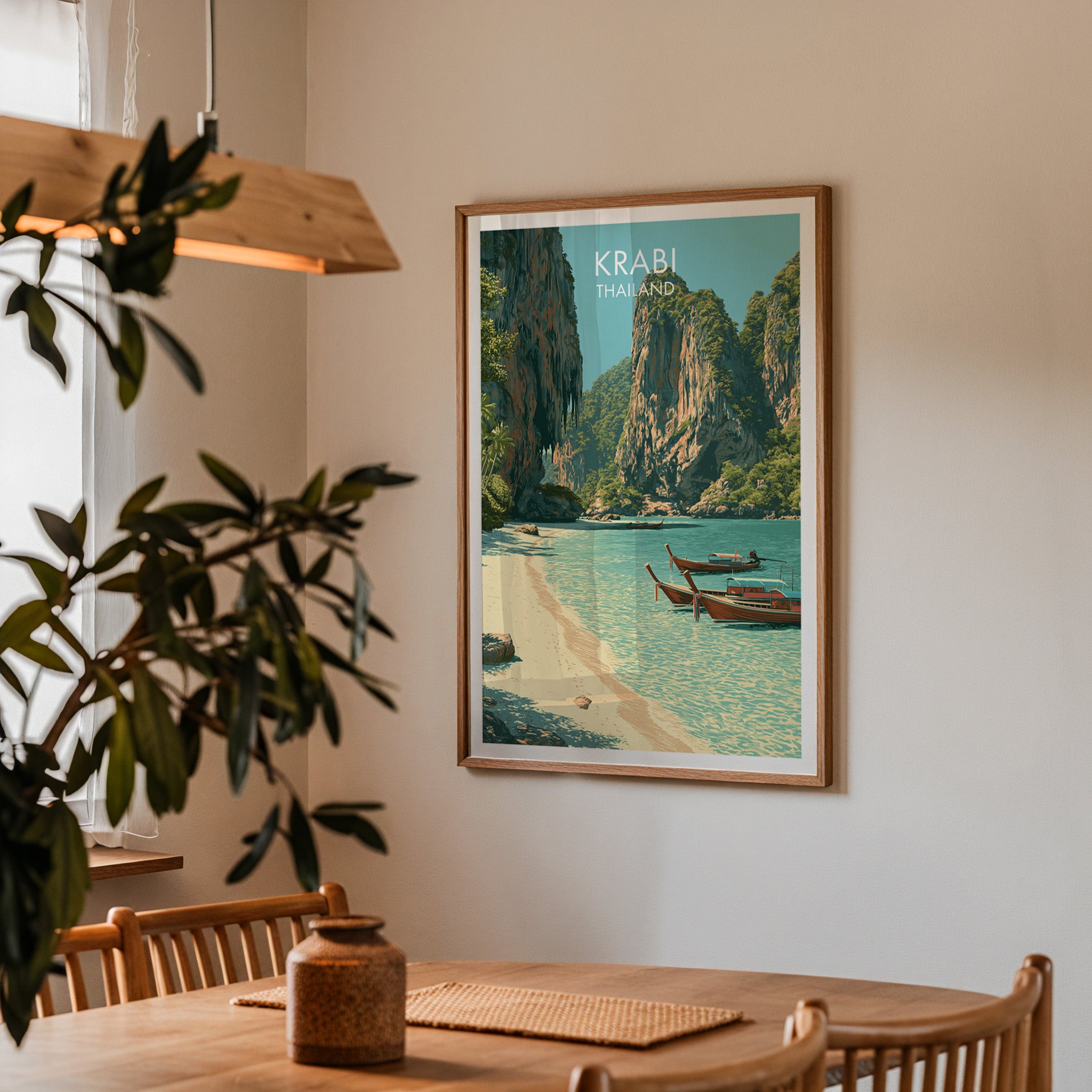 Framed Railay Beach Krabi Thailand print on a dining room wall above an oak table in warm afternoon light