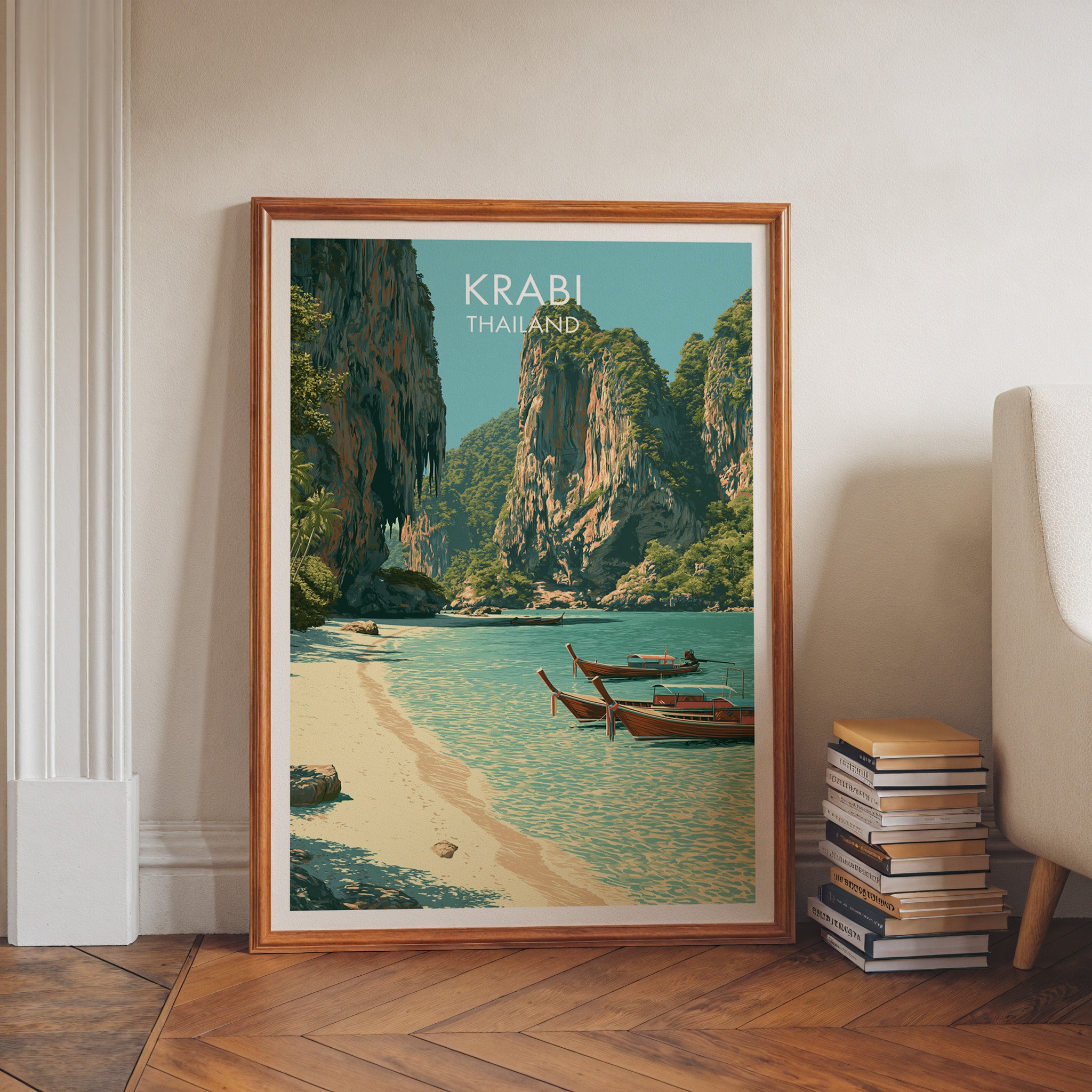 Railay Beach Krabi Thailand art print in a walnut frame leaning in a hallway beside stacked books