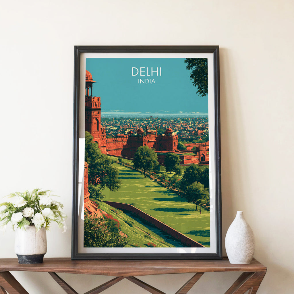 Red Fort Delhi India travel poster in a black frame on a wooden console table with white flowers