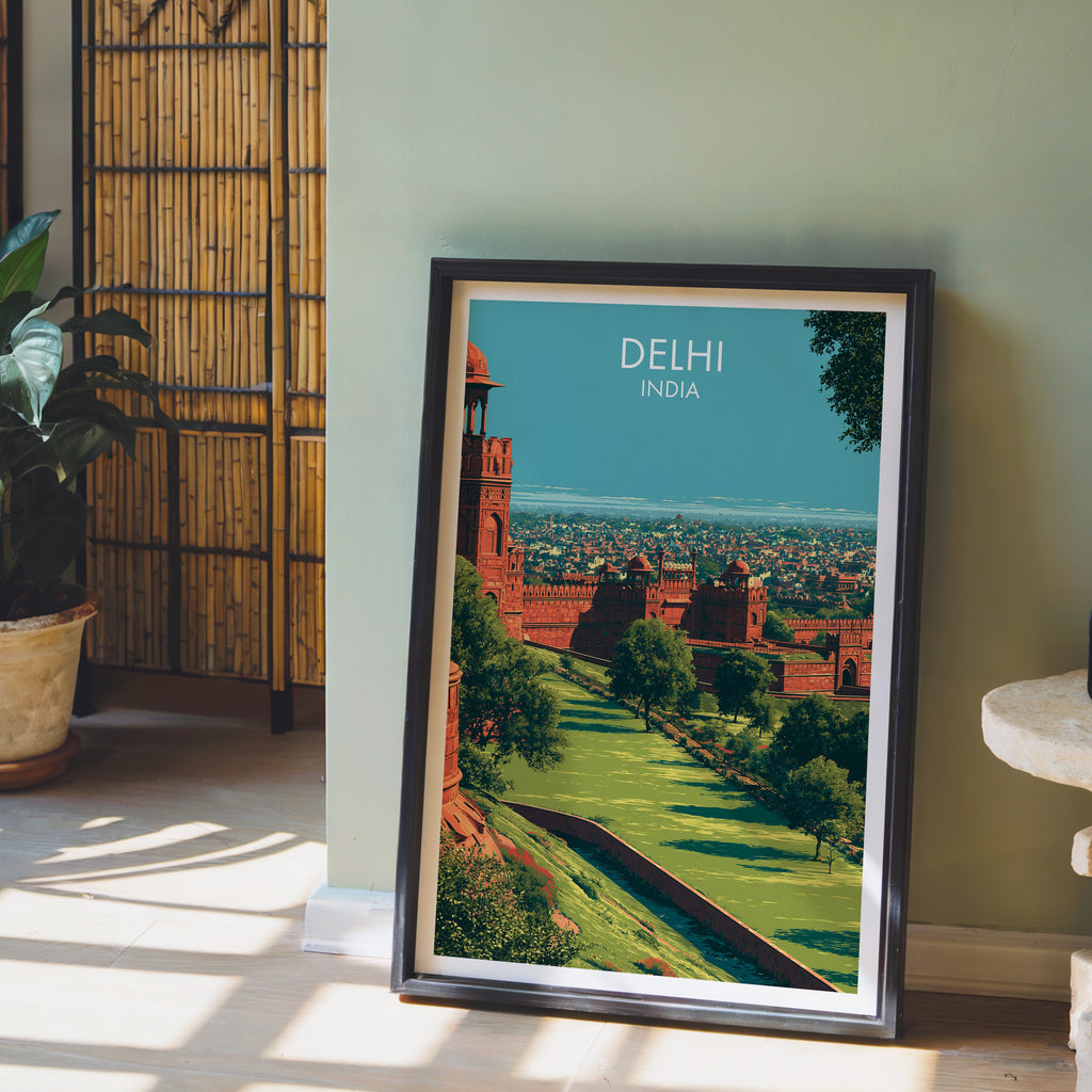 Red Fort Delhi India wall art in a black frame leaning against a sage green wall beside a bamboo screen
