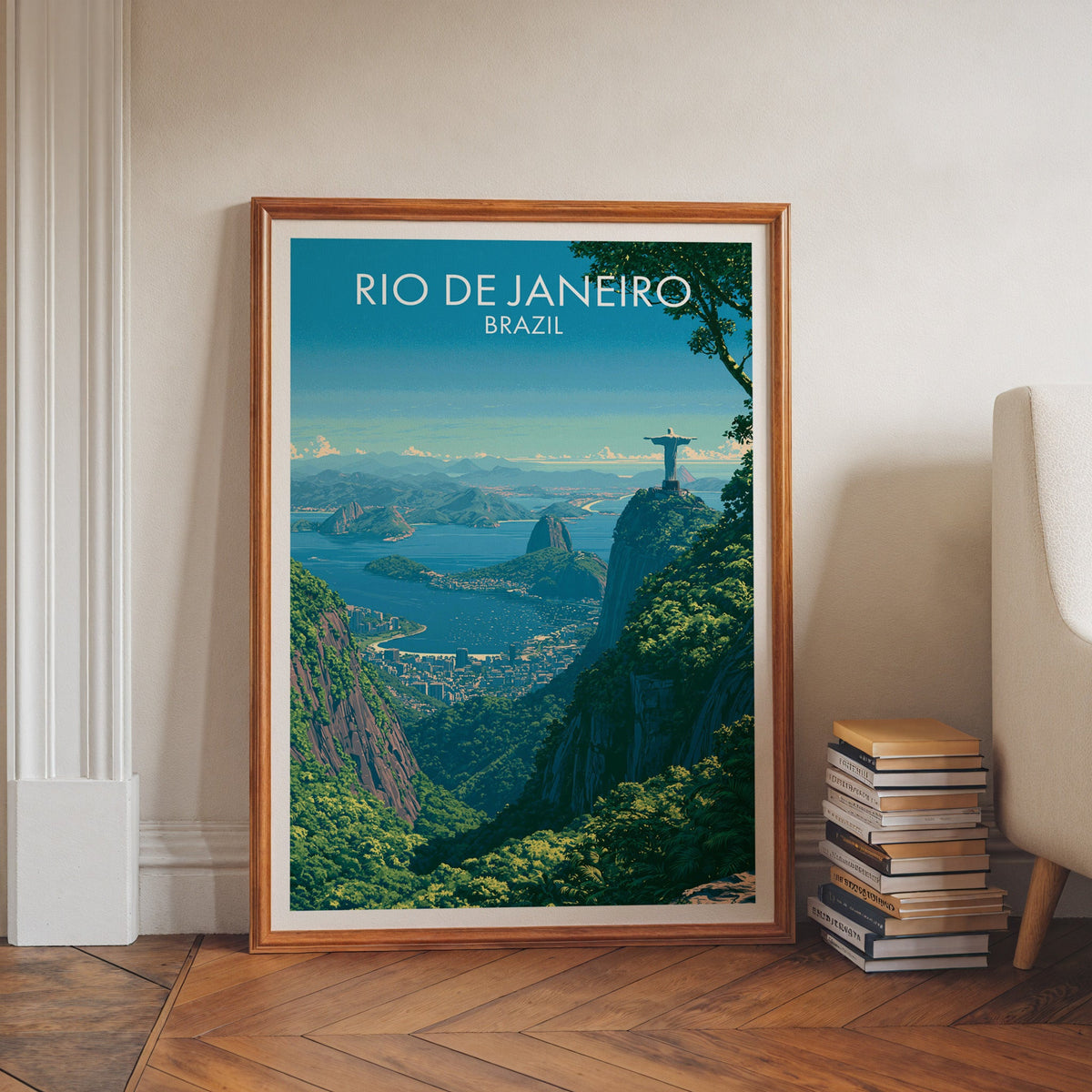 Corcovado statue wall art in a walnut frame on a herringbone floor by white moulding, book stacks and an armchair