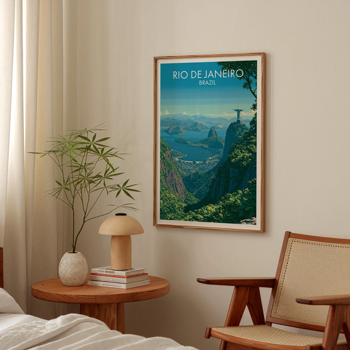 Rio bay and statue print in a walnut frame in a bedroom above a round nightstand with a terracotta mushroom lamp