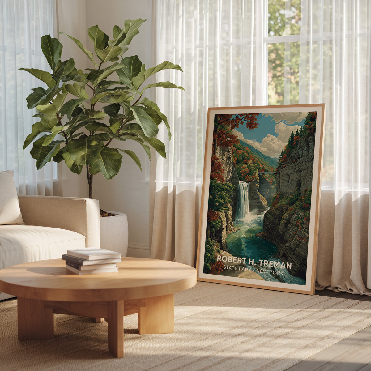 Autumn gorge print in an oak frame by a sheer-curtained window with a large plant and round table