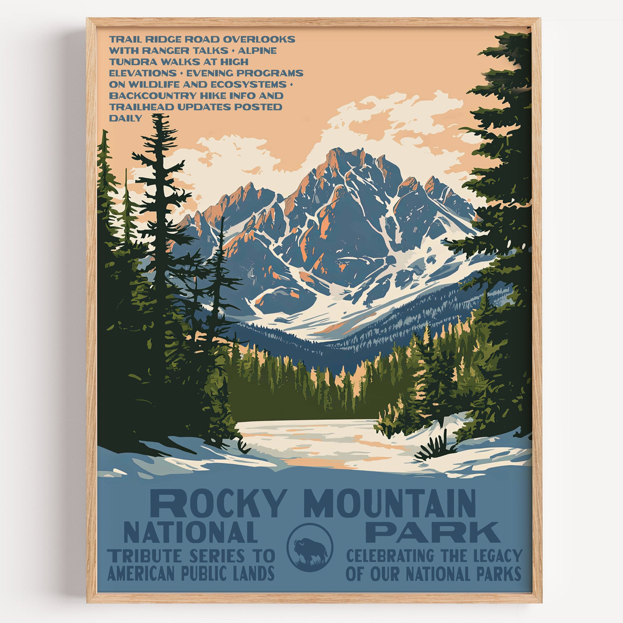 Rocky Mountain National Park wall art print in a thin wood frame, a snow-capped peak above a still lake and pines
