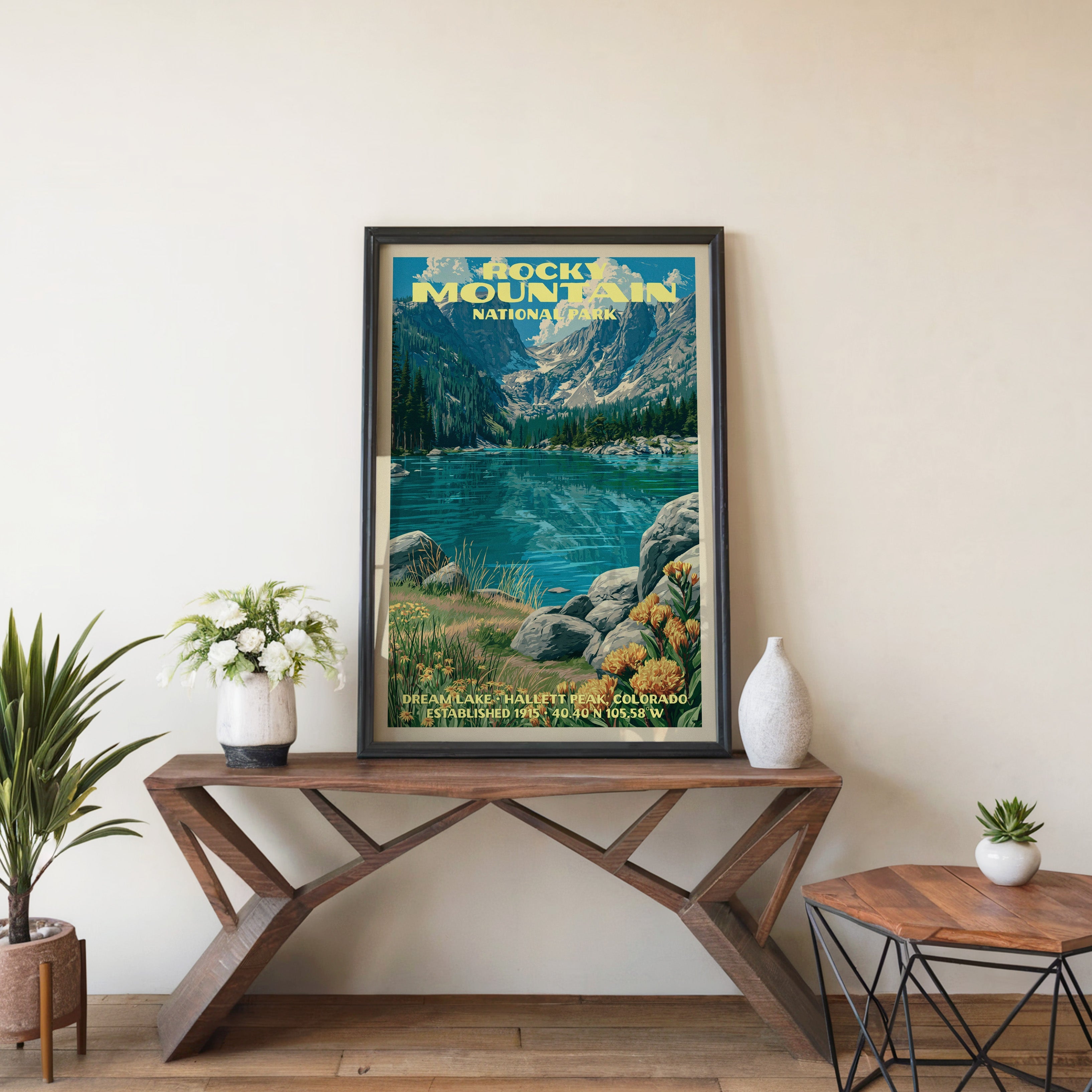 Dream Lake wall art in black, leaning on a walnut console with white anemones and a small white vase