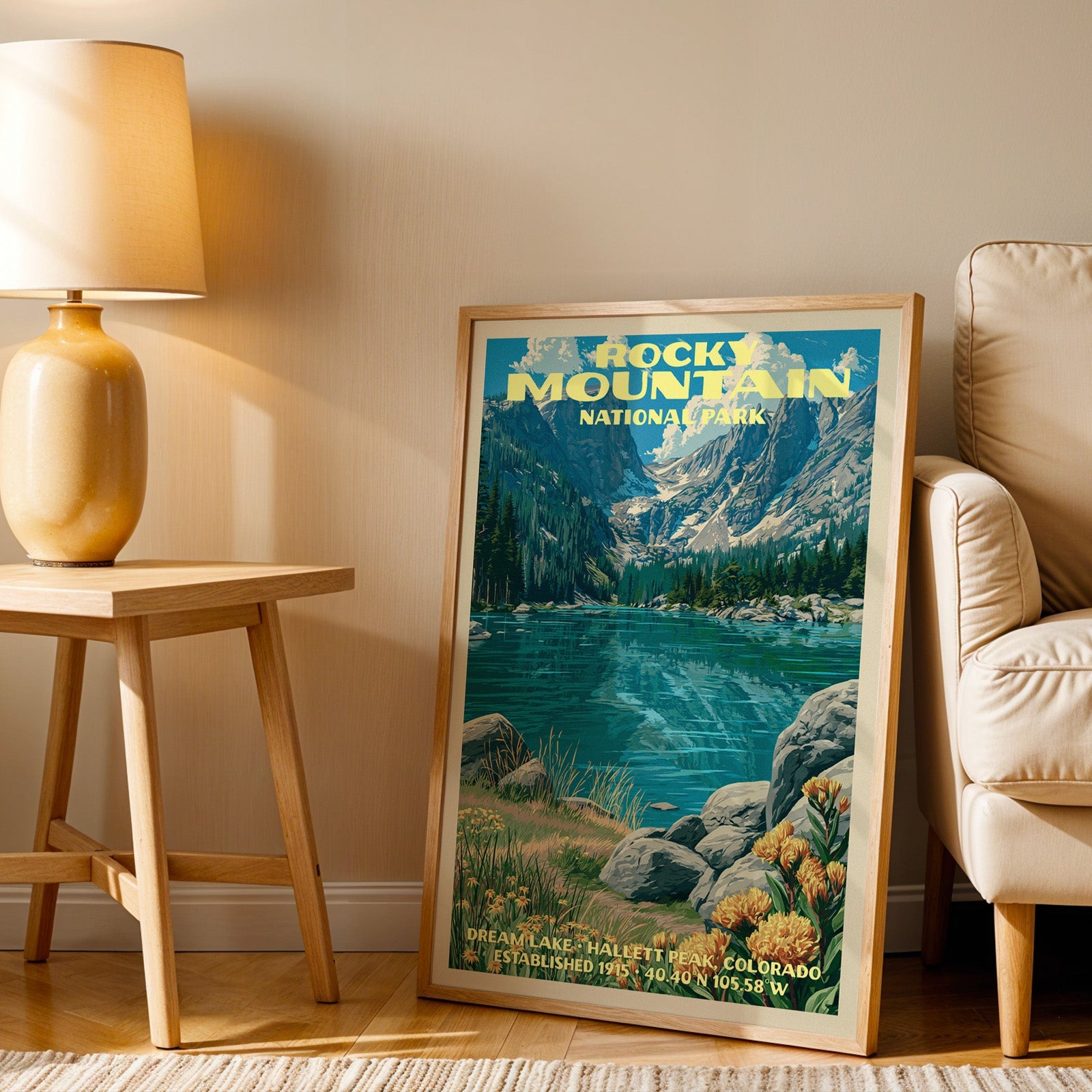 Dream Lake Rocky Mountain wall art in oak, leaning by an armchair and a side table with an ochre lamp