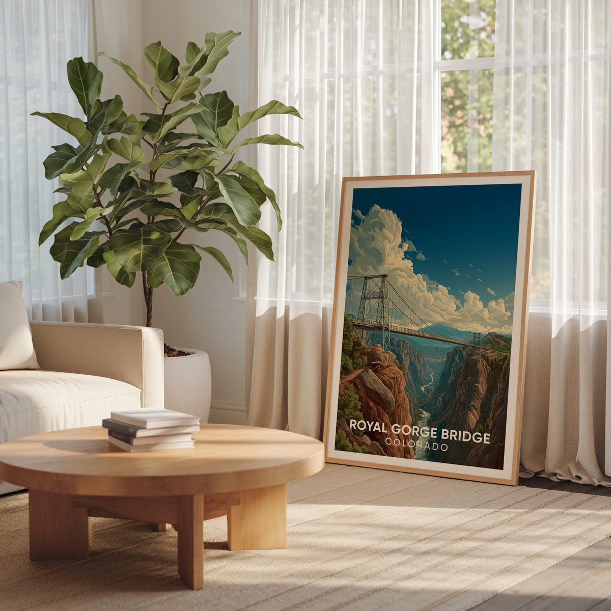 Deep canyon bridge print in an oak frame by a curtained window with a broad-leafed plant