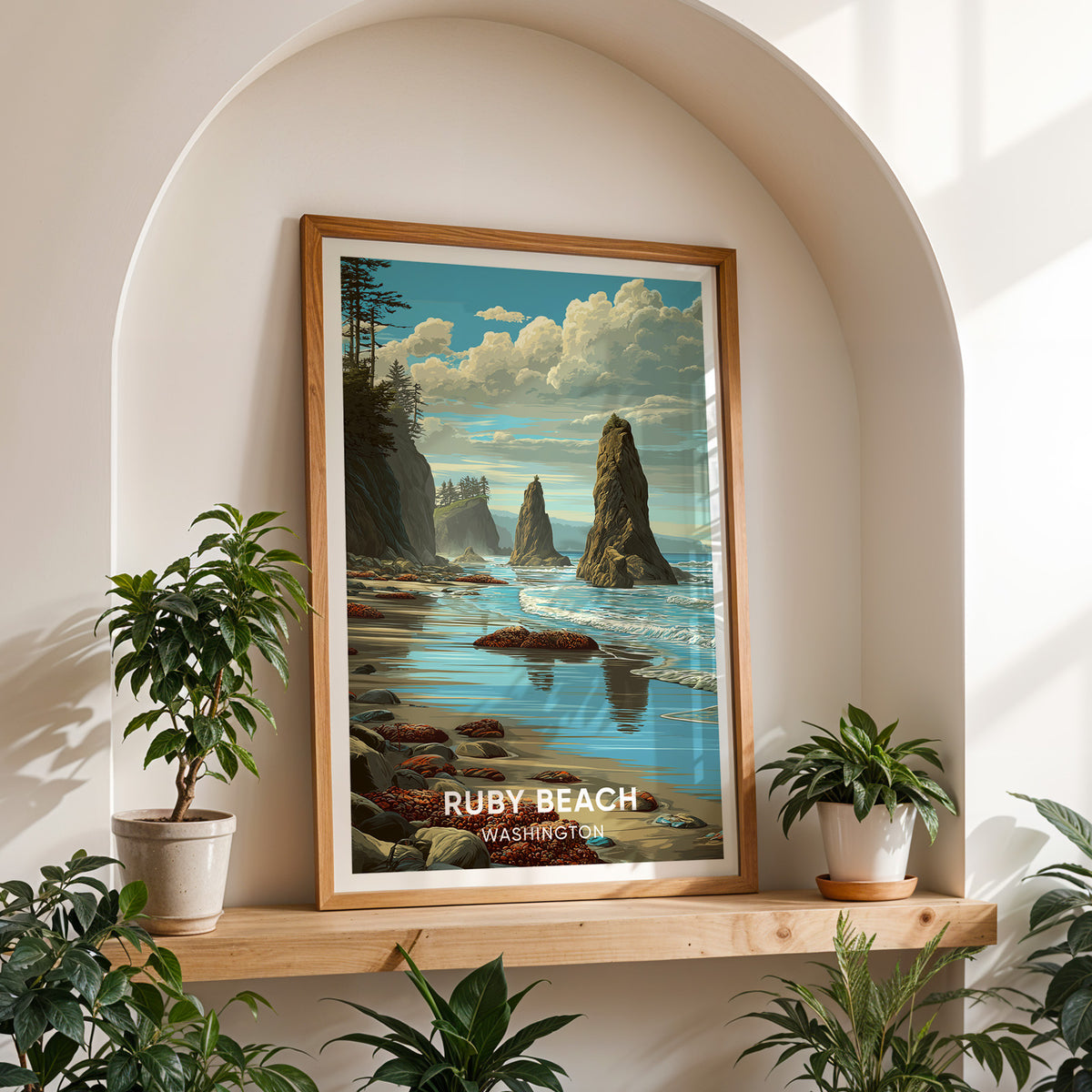 Ruby Beach print in oak on a timber shelf in a white arched niche between two potted plants