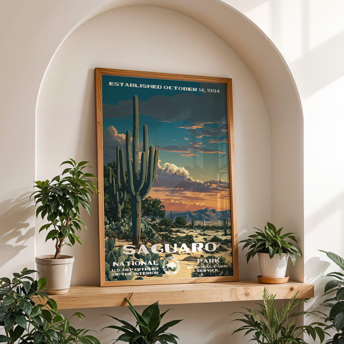Saguaro National Park retro travel print framed on a wooden shelf in a sunlit arched alcove