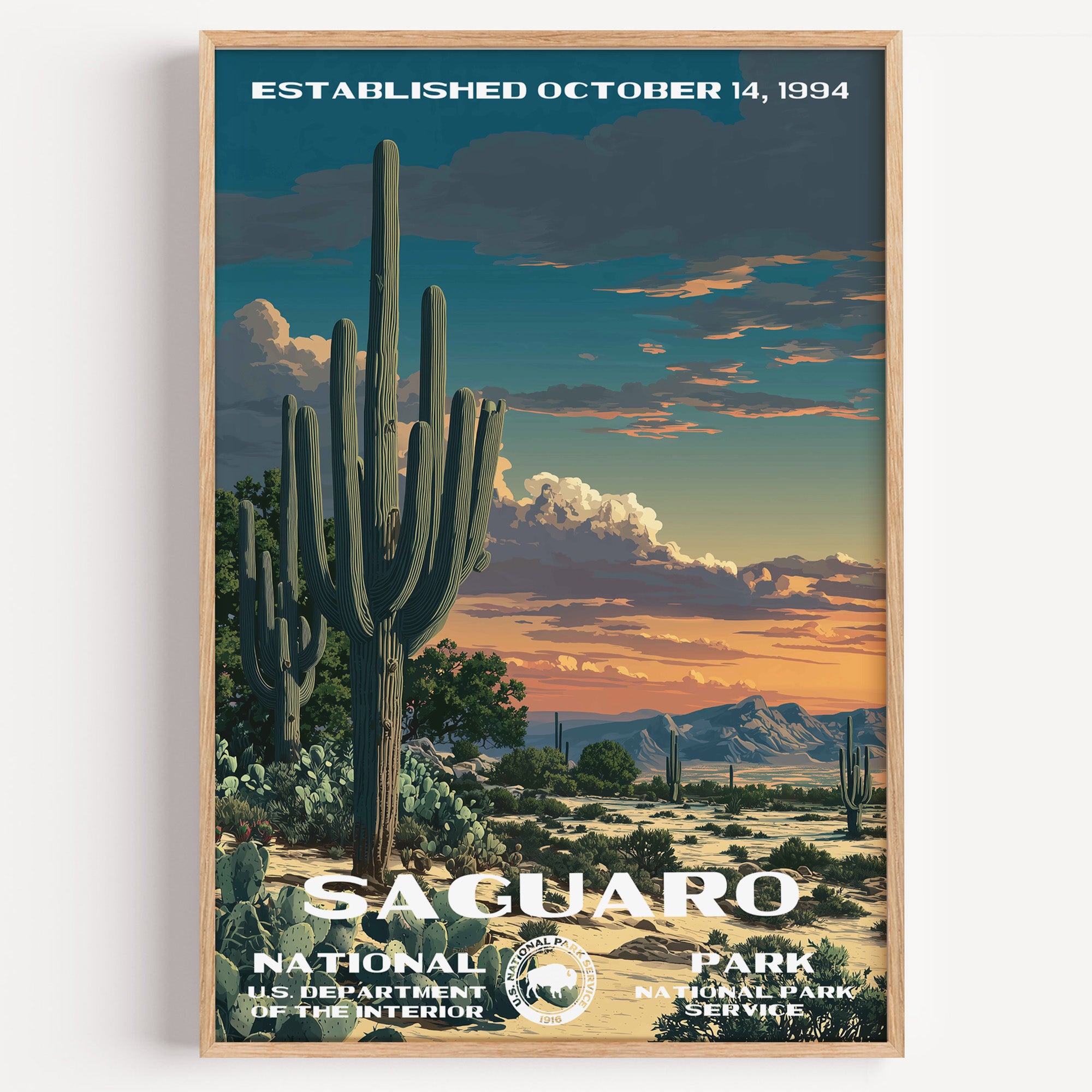 Saguaro National Park vintage travel poster in a wood frame, saguaro cacti standing against a burning orange desert sunset