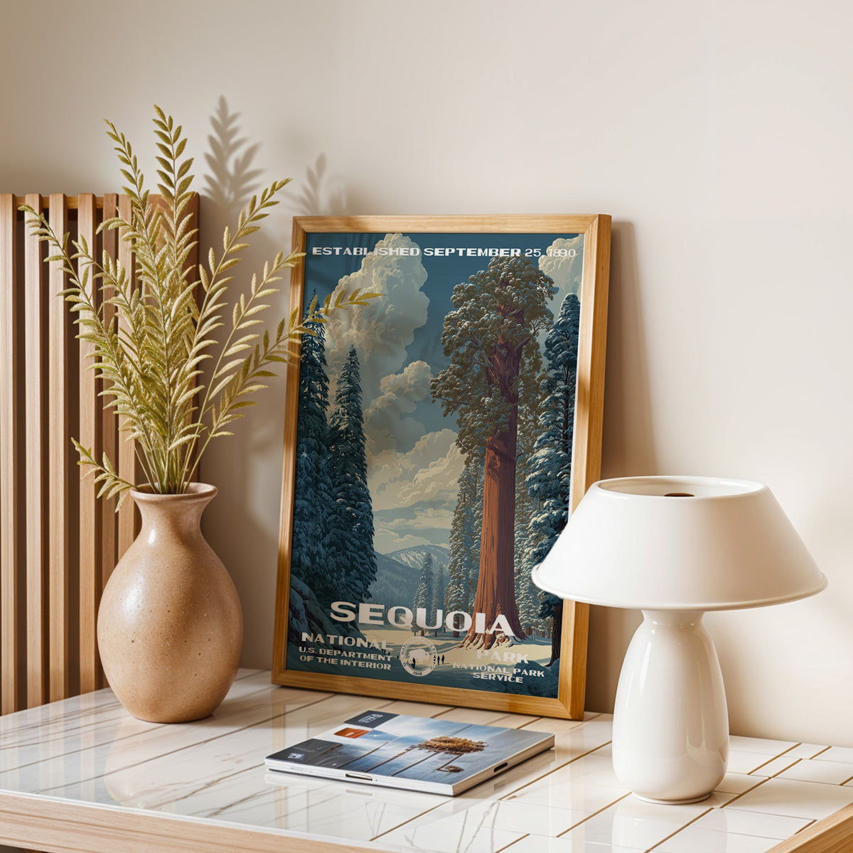 Sequoia National Park vintage print leaning on a table with a ceramic lamp and dried grasses