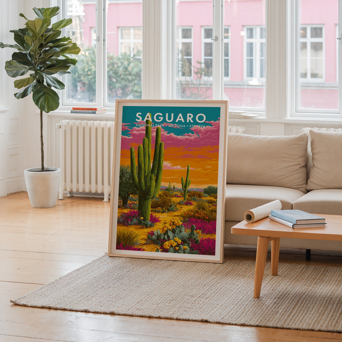 Saguaro National Park mid-century modern art print propped in a neutral living room behind a low oak coffee table — living room wall art