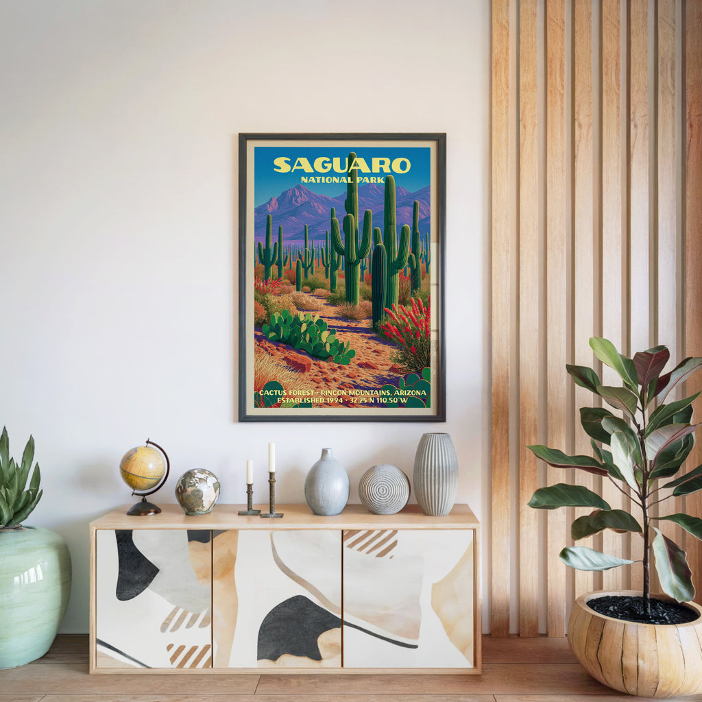 Saguaro National Park print in a black frame above a light wood sideboard by a slatted wall panel