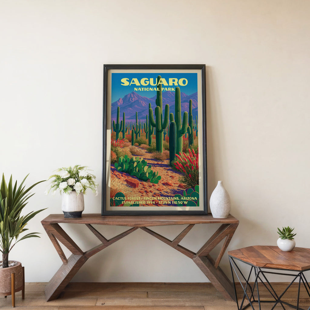 Saguaro Cactus Forest wall art in black, leaning on a walnut console with white anemones and a vase