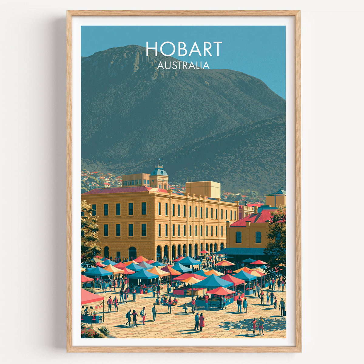 Salamanca Place Hobart travel print in a light oak frame on a plain white wall