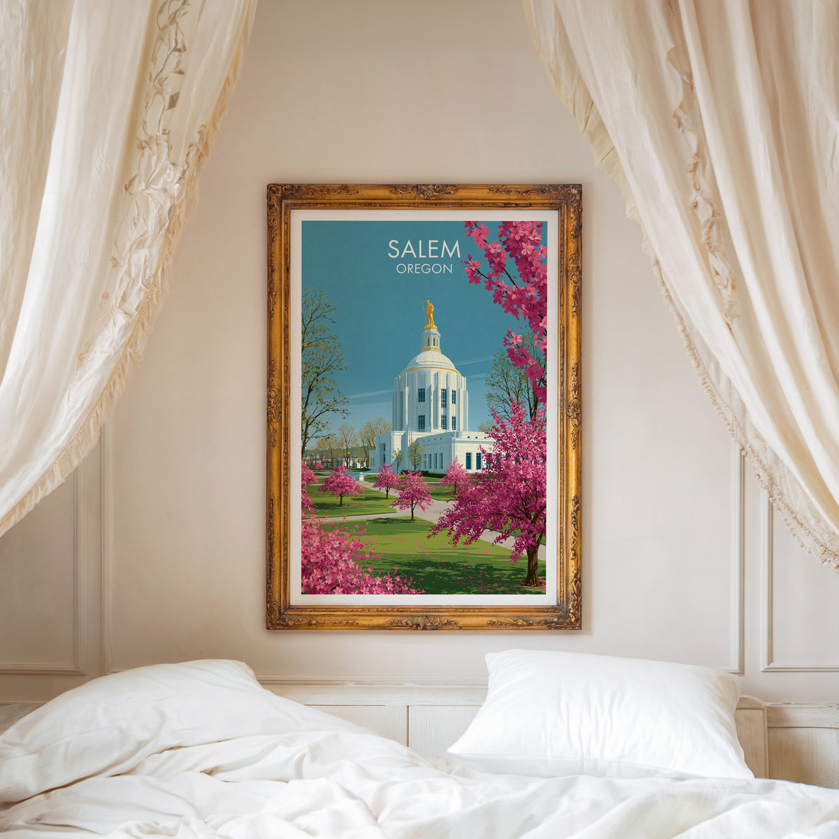 Salem Oregon art in a carved gold frame above a white bed with a linen canopy and moulded wall.
