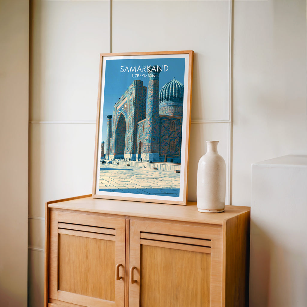 Small Samarkand Uzbekistan travel poster in an oak frame on a mid-century sideboard with a ceramic vase