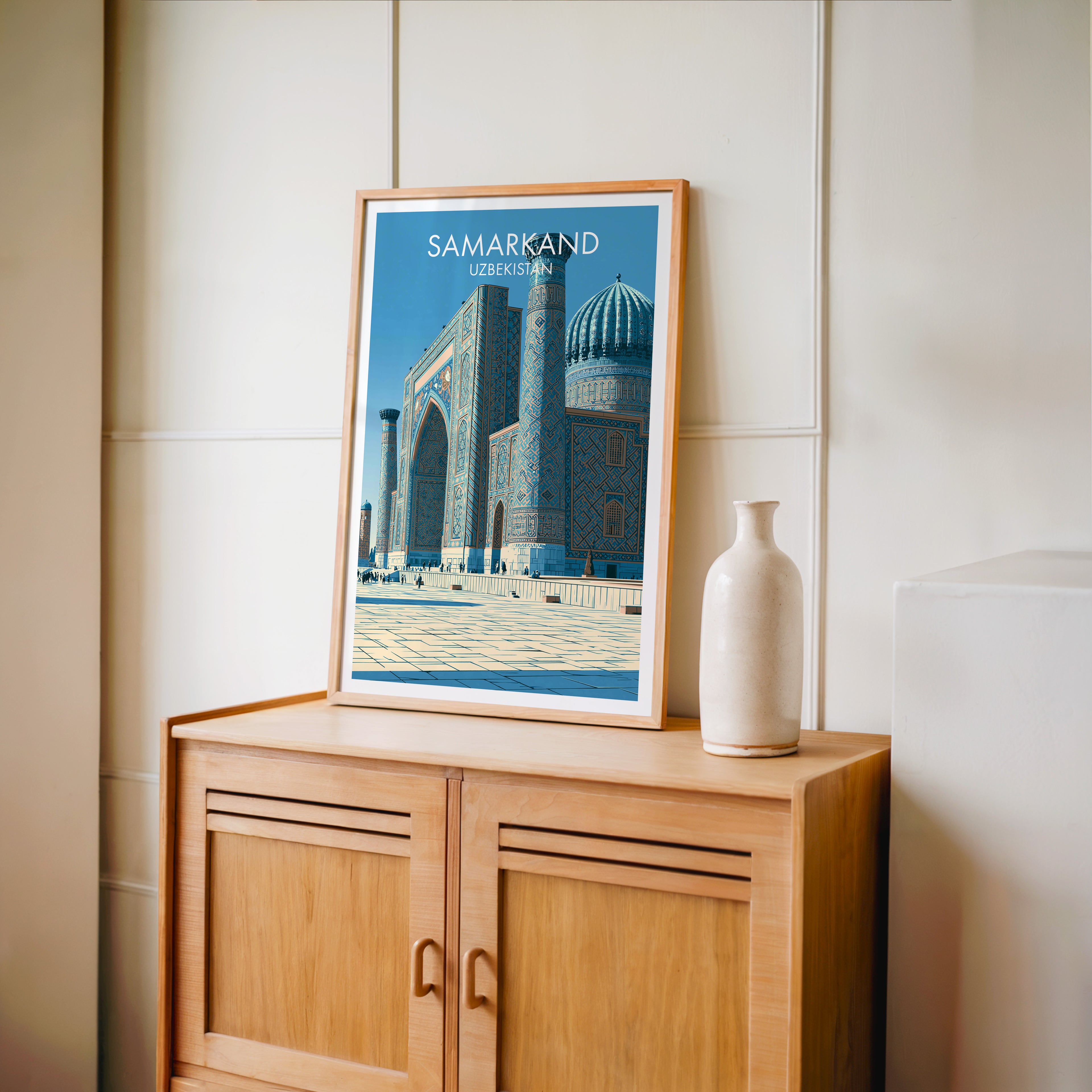 Small Samarkand Uzbekistan travel poster in an oak frame on a mid-century sideboard with a ceramic vase