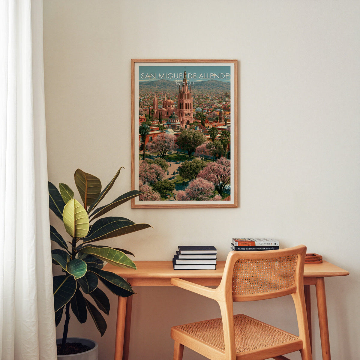 Mountain ridge behind the town, oak frame over a home-office desk with a cane chair and rubber plant