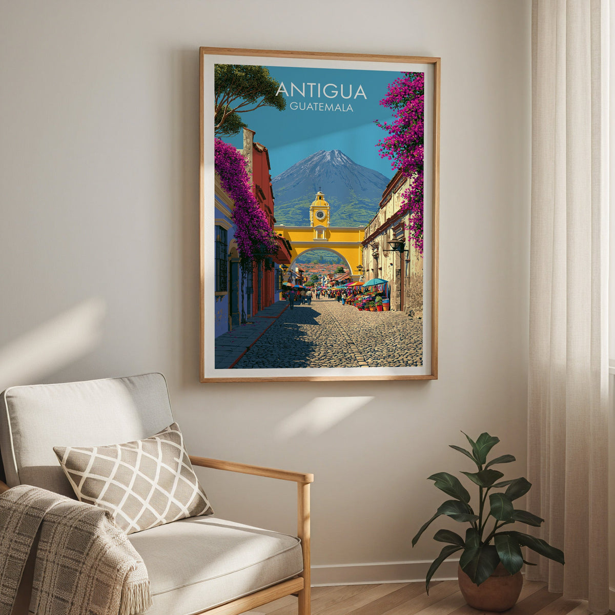 Yellow, magenta and cobalt street scene in an oak frame above a cream armchair with a check cushion and curtain