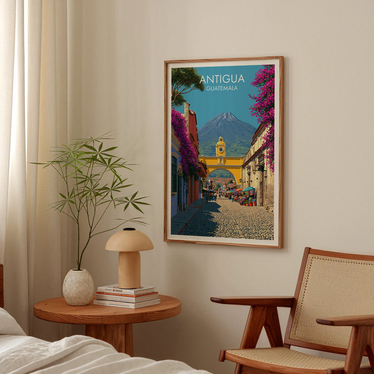 Volcano behind the Antigua archway, oak frame in a bedroom above a round bedside table with a mushroom lamp