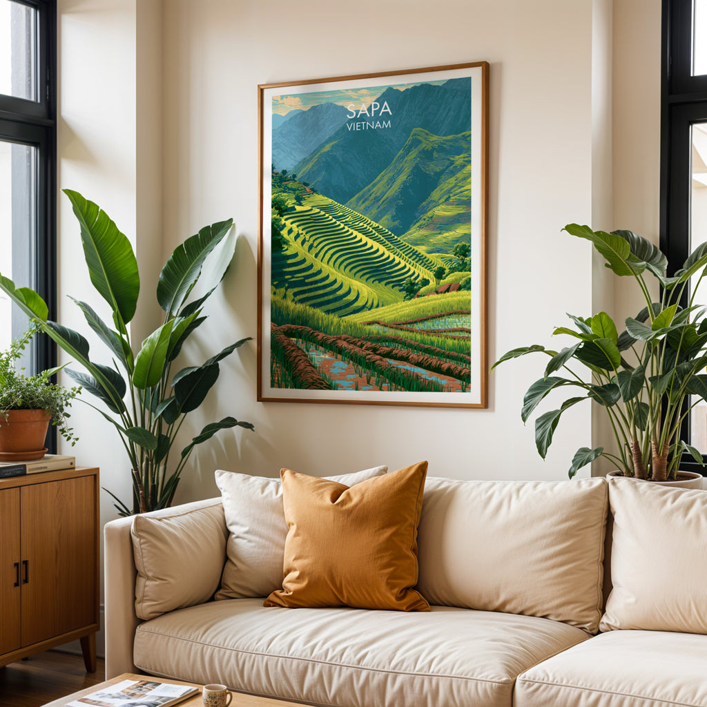 Framed Sapa Vietnam wall art hanging above a cream sofa in a bright living room with tropical plants