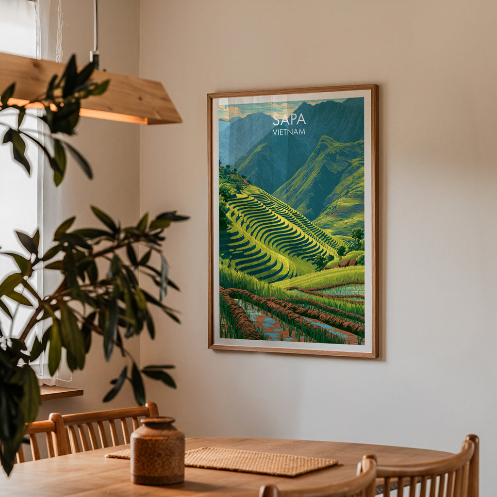 Framed Sapa Vietnam print on a dining room wall above an oak table in warm afternoon light