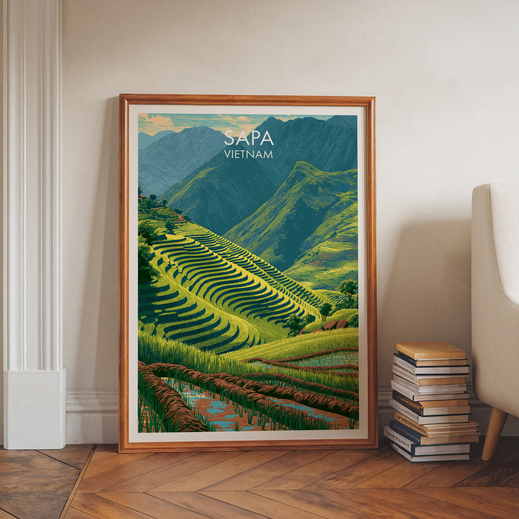 Sapa Vietnam art print in a walnut frame leaning in a hallway beside stacked books