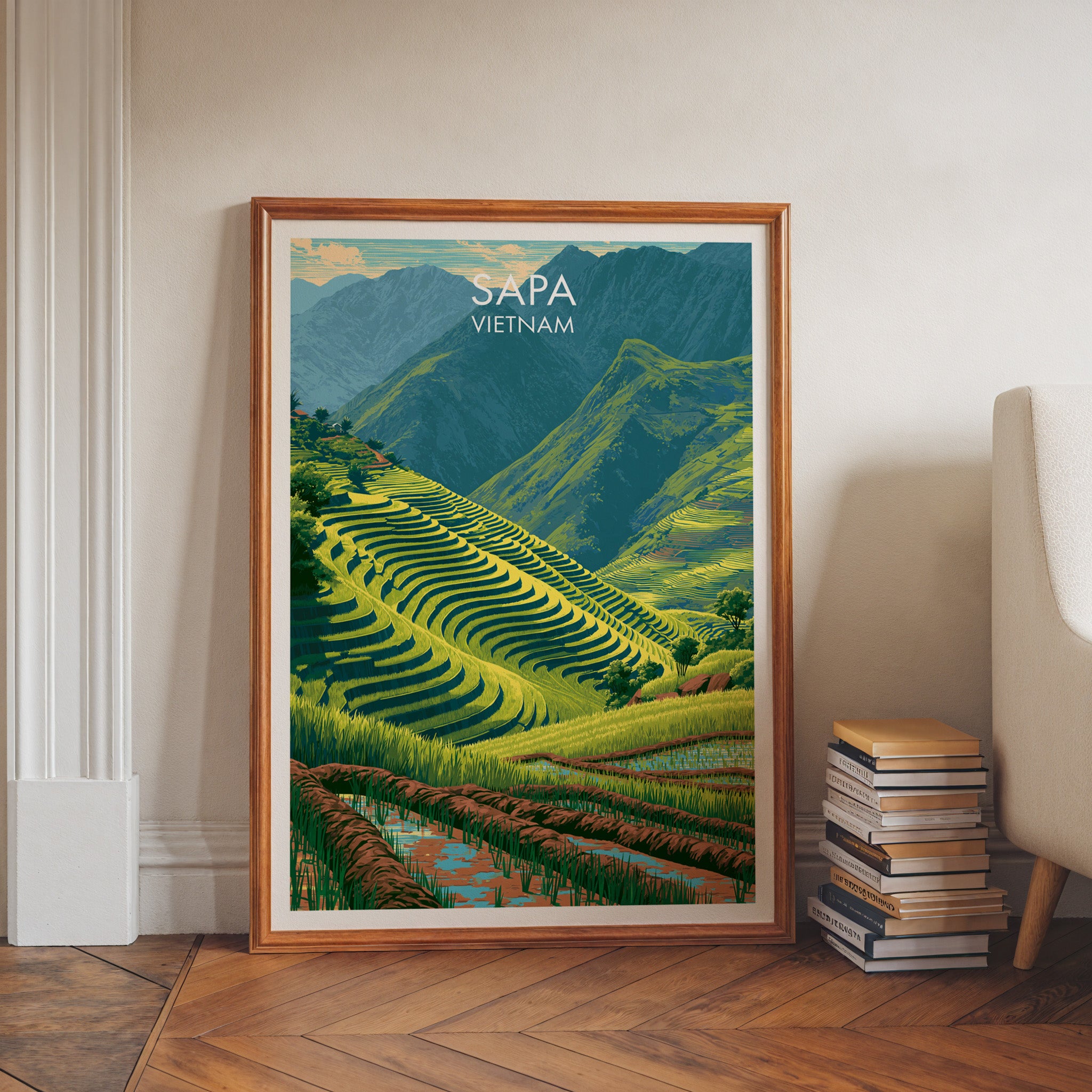 Sapa Vietnam art print in a walnut frame leaning in a hallway beside stacked books