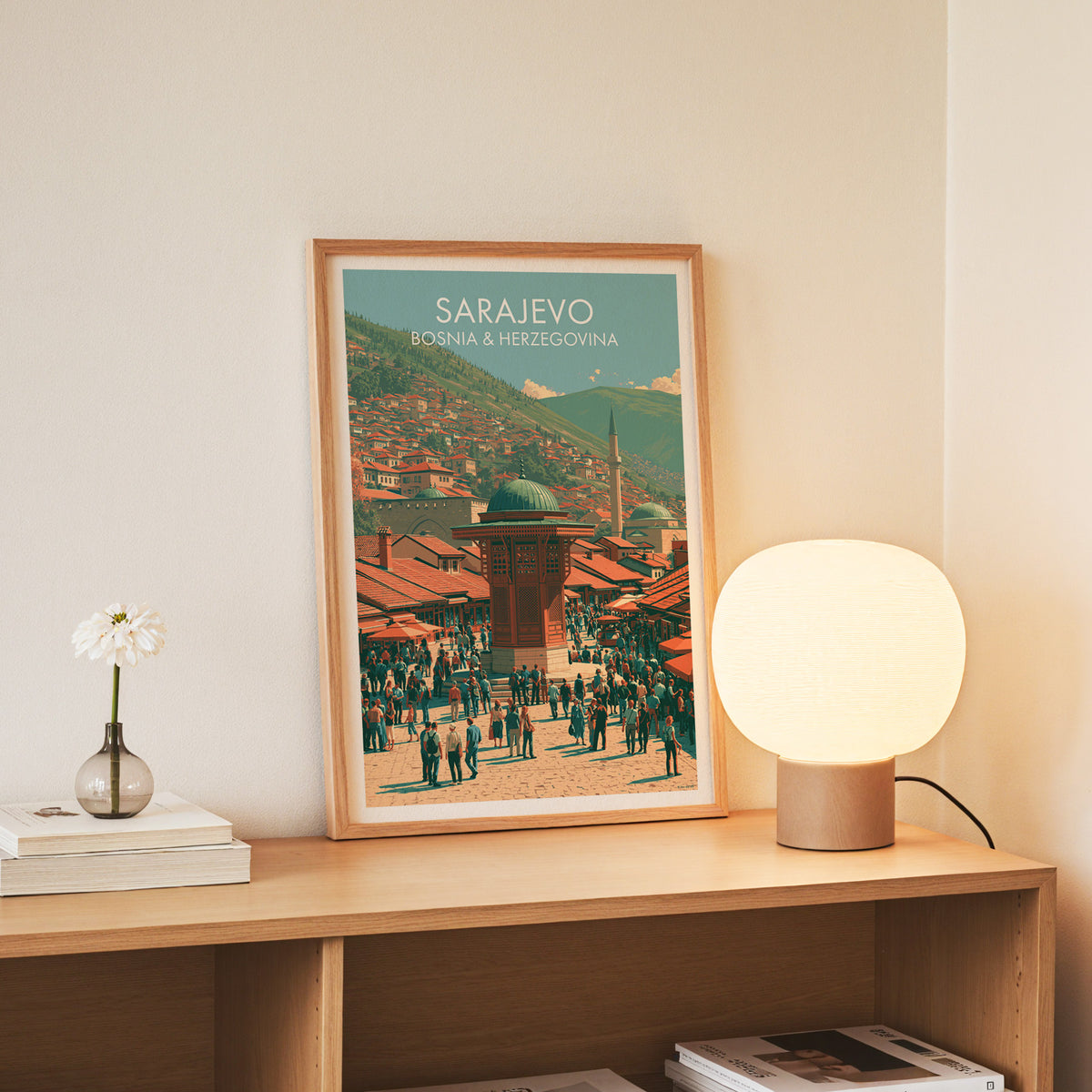 Sarajevo Bosnia wall art, slim oak frame standing on an oak console beside a daisy in a glass bottle