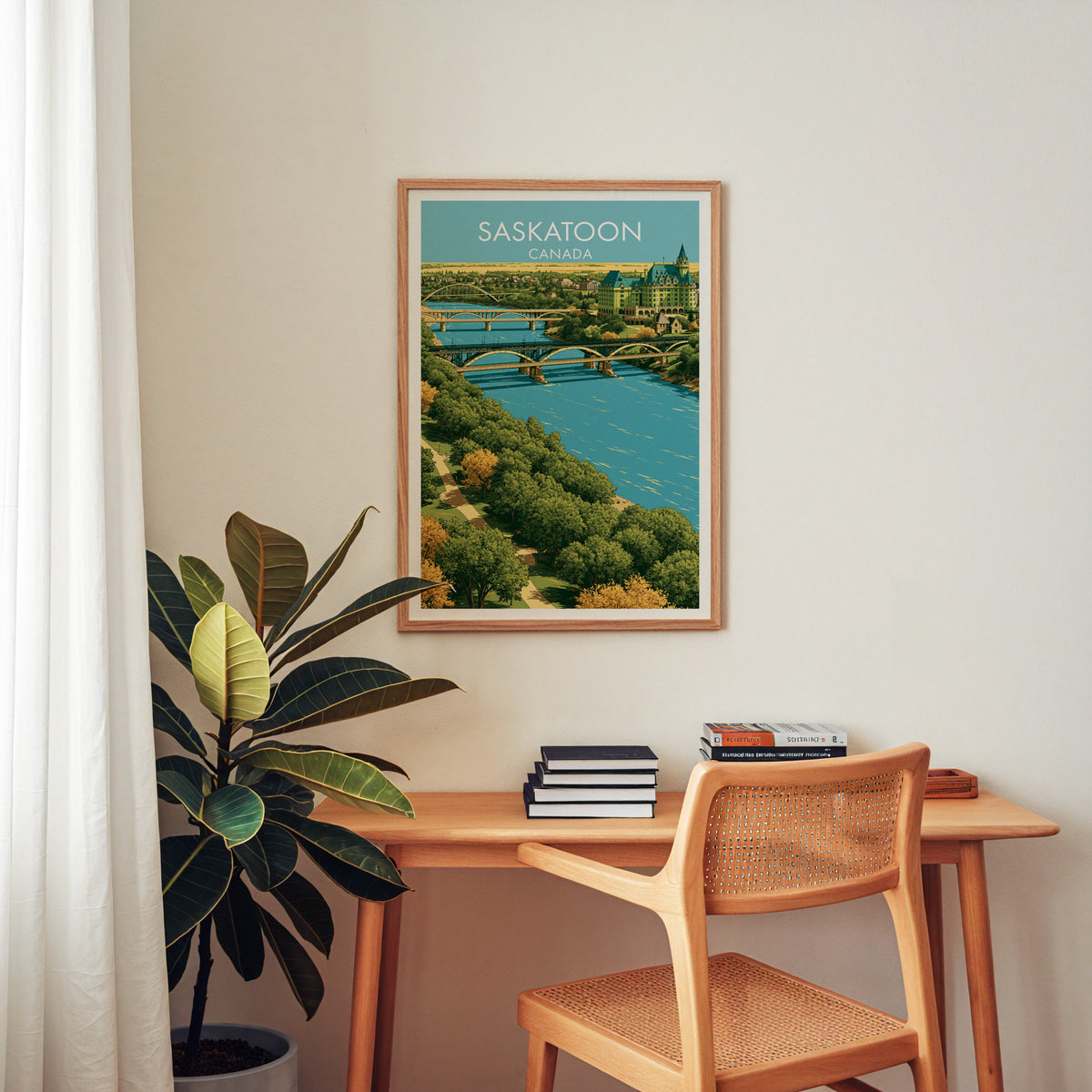 Saskatoon Canada travel print in an oak frame above a wood desk with a cane chair