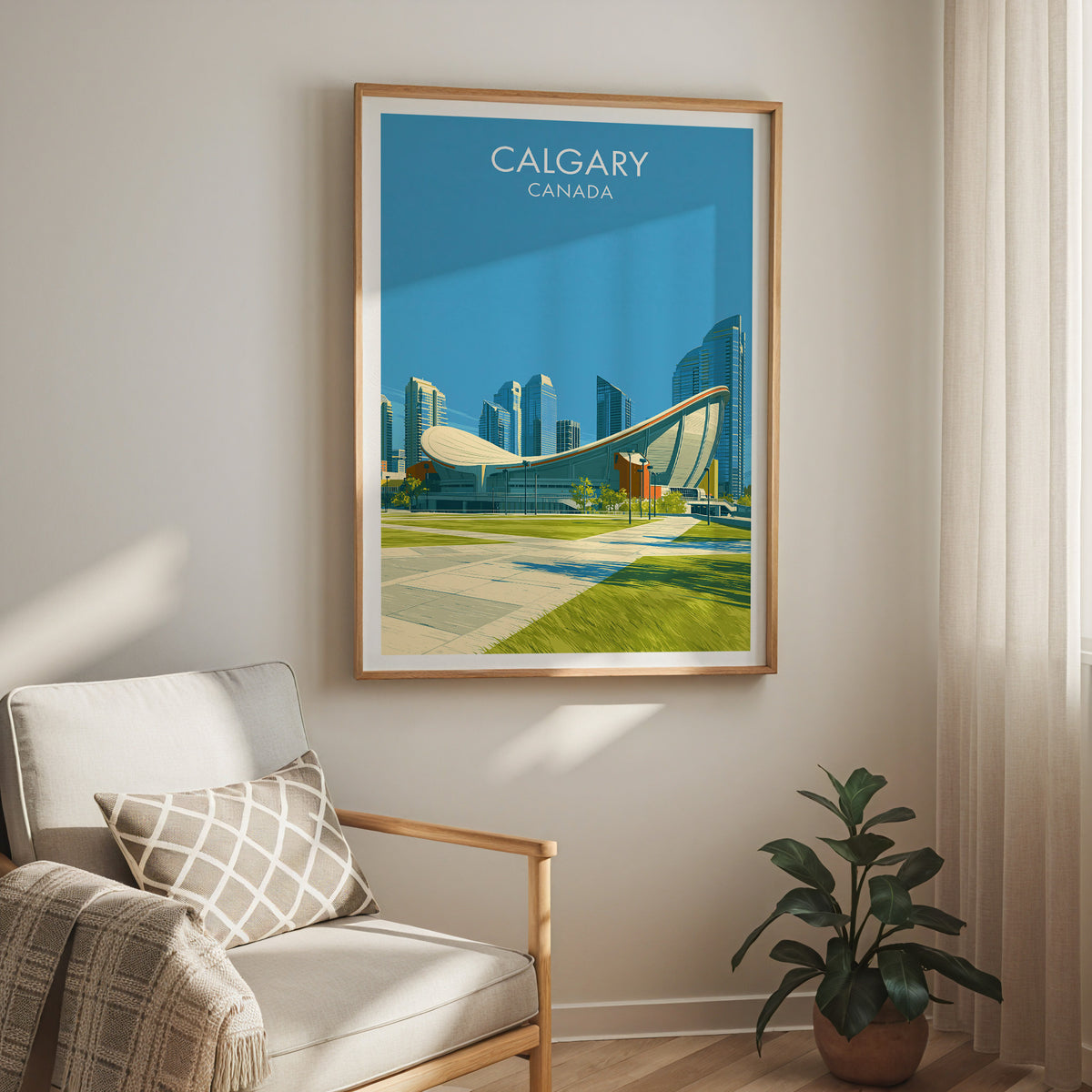 Calgary arena roof print in an oak frame above a cream armchair and a rubber plant