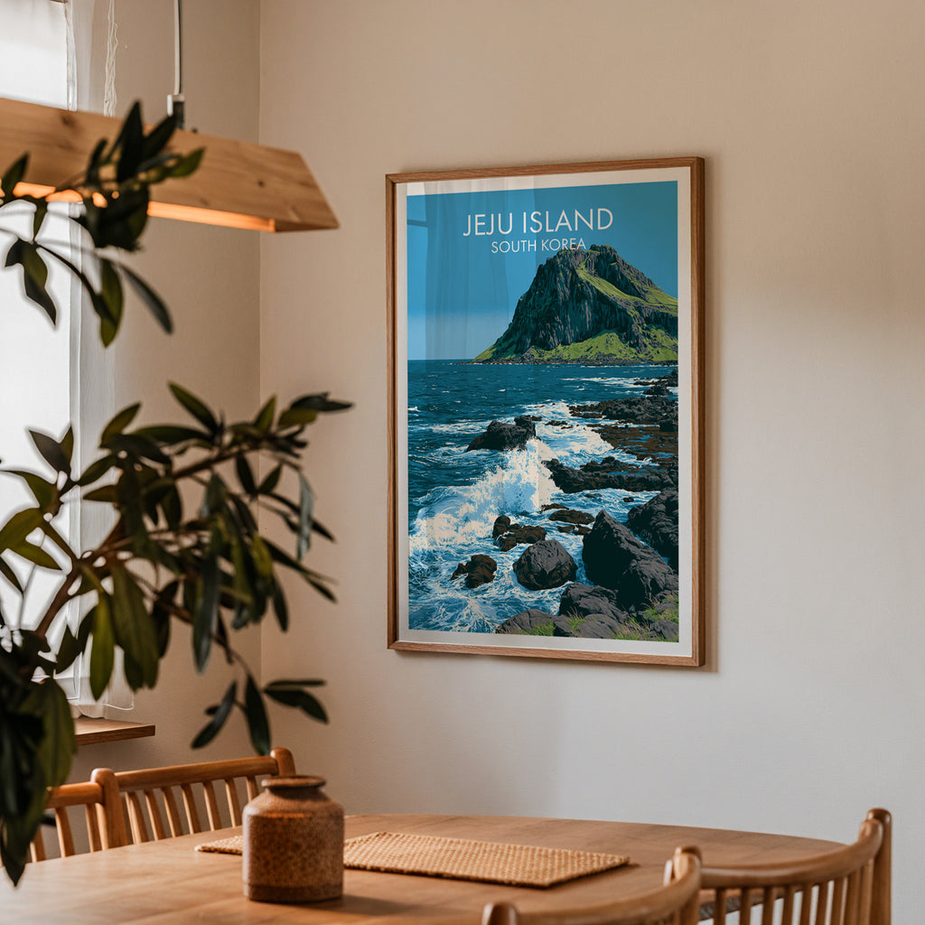Framed Seongsan Ilchulbong Jeju Korea print on a dining room wall above an oak table in warm afternoon light