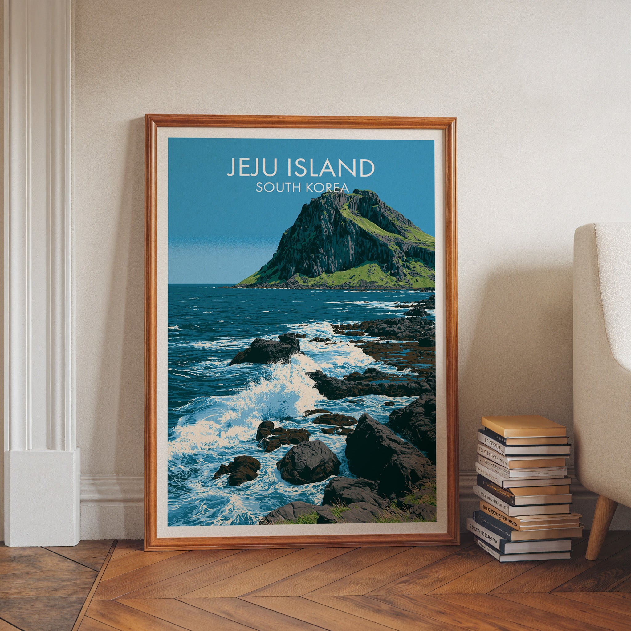 Seongsan Ilchulbong Jeju Korea art print in a walnut frame leaning in a hallway beside stacked books
