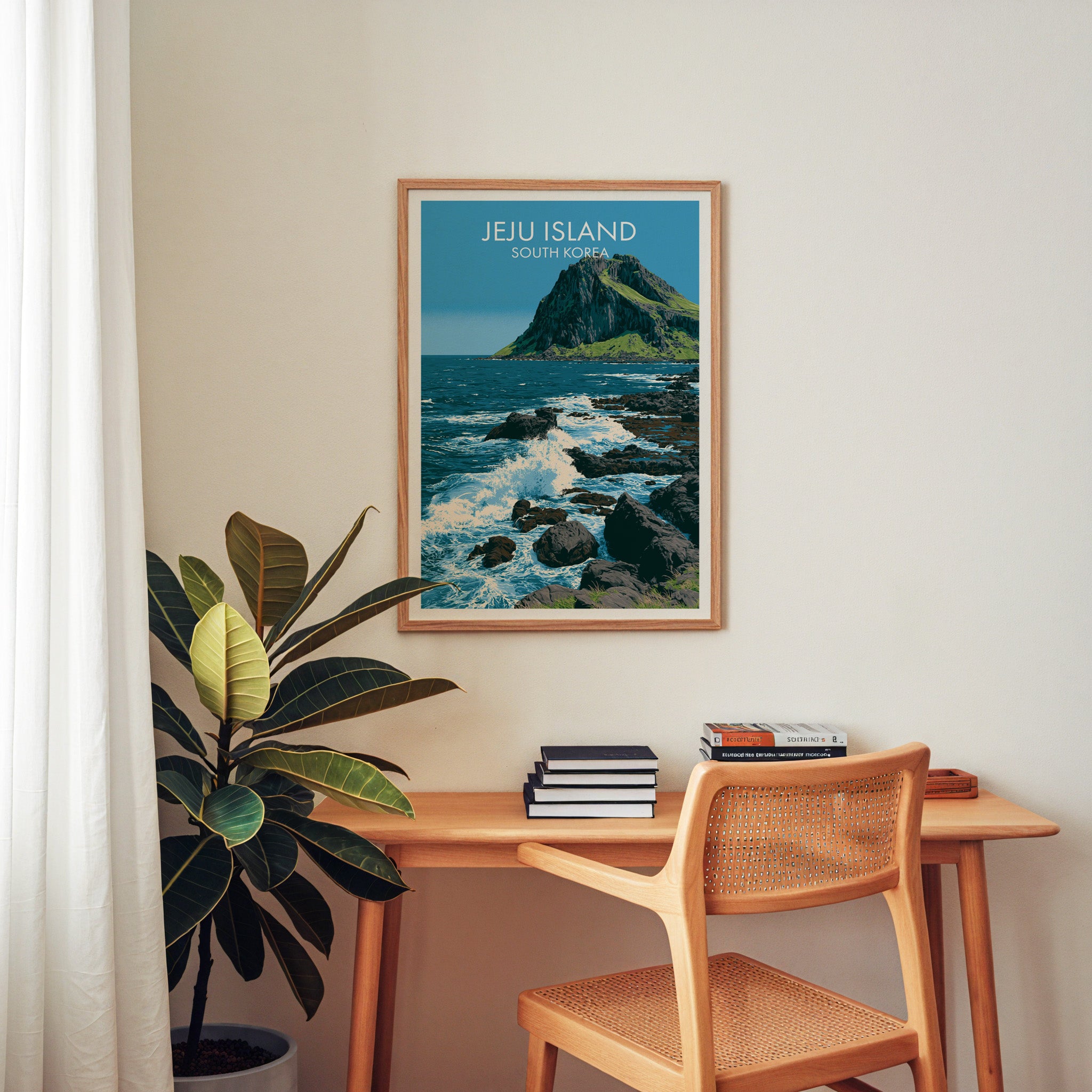 Seongsan Ilchulbong Jeju Korea wall art above a wooden home office desk with a rattan chair and books