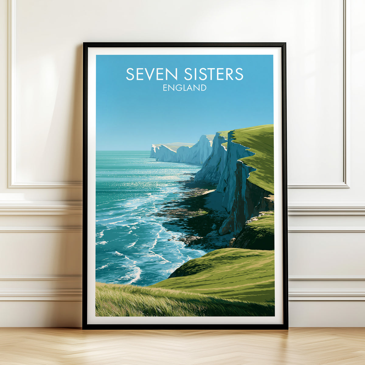Seven Sisters chalk print, black frame leaning on a white panelled wall above a herringbone floor
