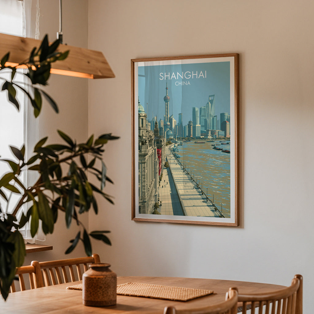 Framed Shanghai China print on a dining room wall above an oak table in warm afternoon light