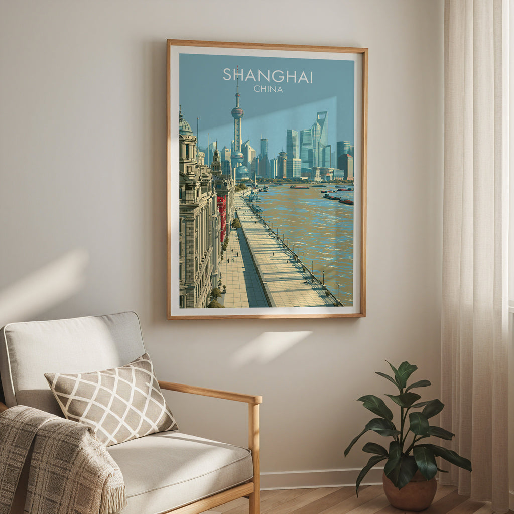 Shanghai China travel print in a light oak frame on a living room wall beside a linen armchair