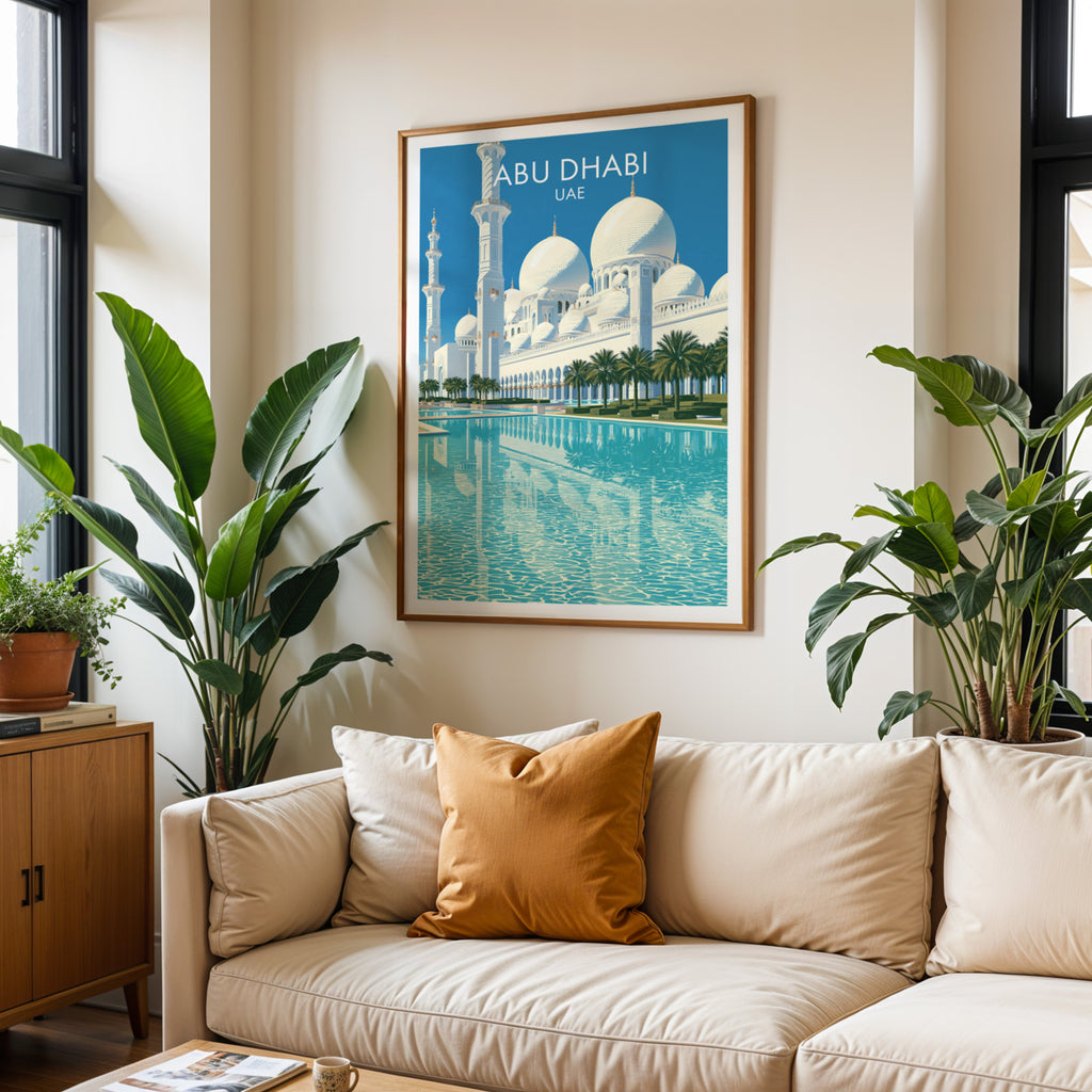 Framed Sheikh Zayed Mosque Abu Dhabi wall art hanging above a cream sofa in a bright living room with tropical plants
